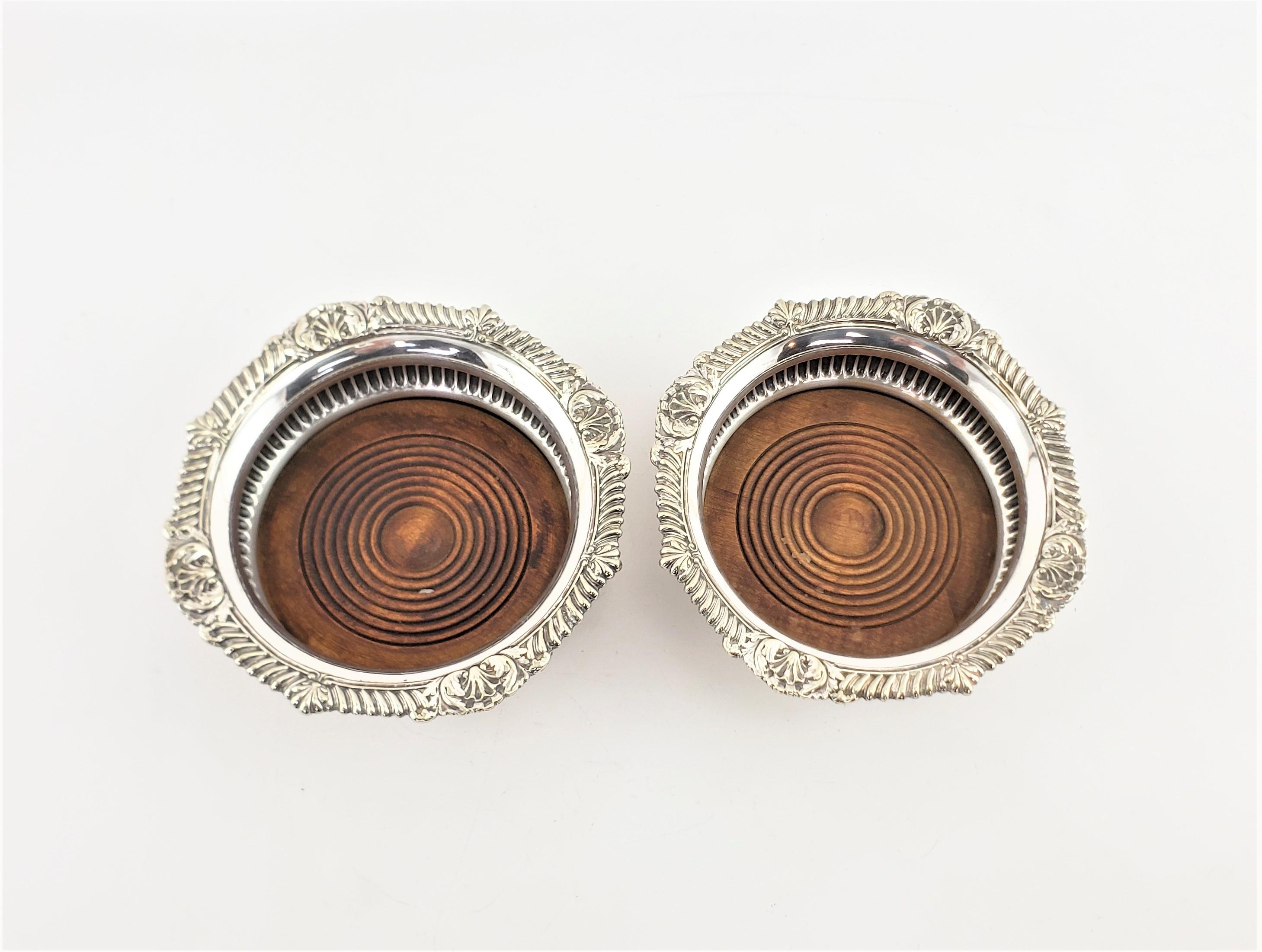 Pair of Antique English Silver Plated Bottle Coasters with Turned Wooden Inserts For Sale 1