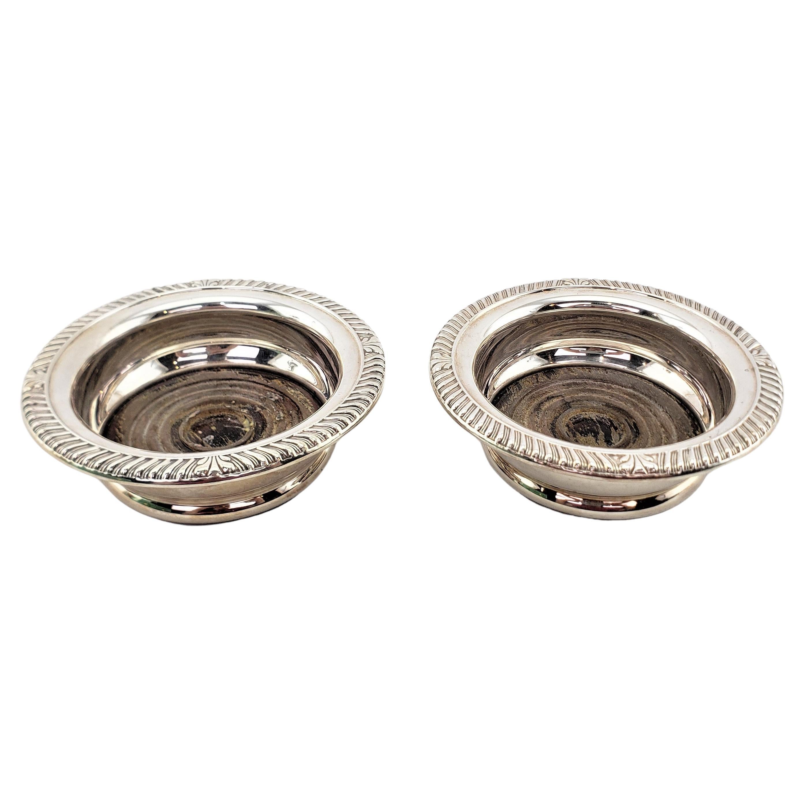 Pair of Antique English Silver Plated Bottle Coasters with Turned Wooden Inserts For Sale