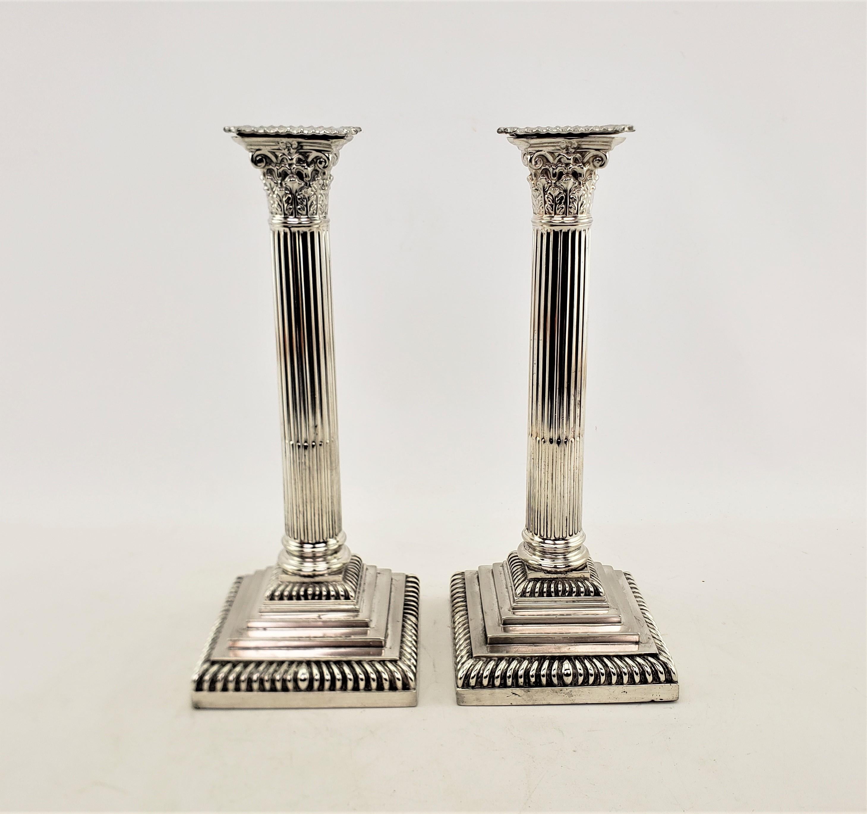 Greek Revival Pair of Antique English Silver Plated Candlesticks in a Corinthian Column Style For Sale