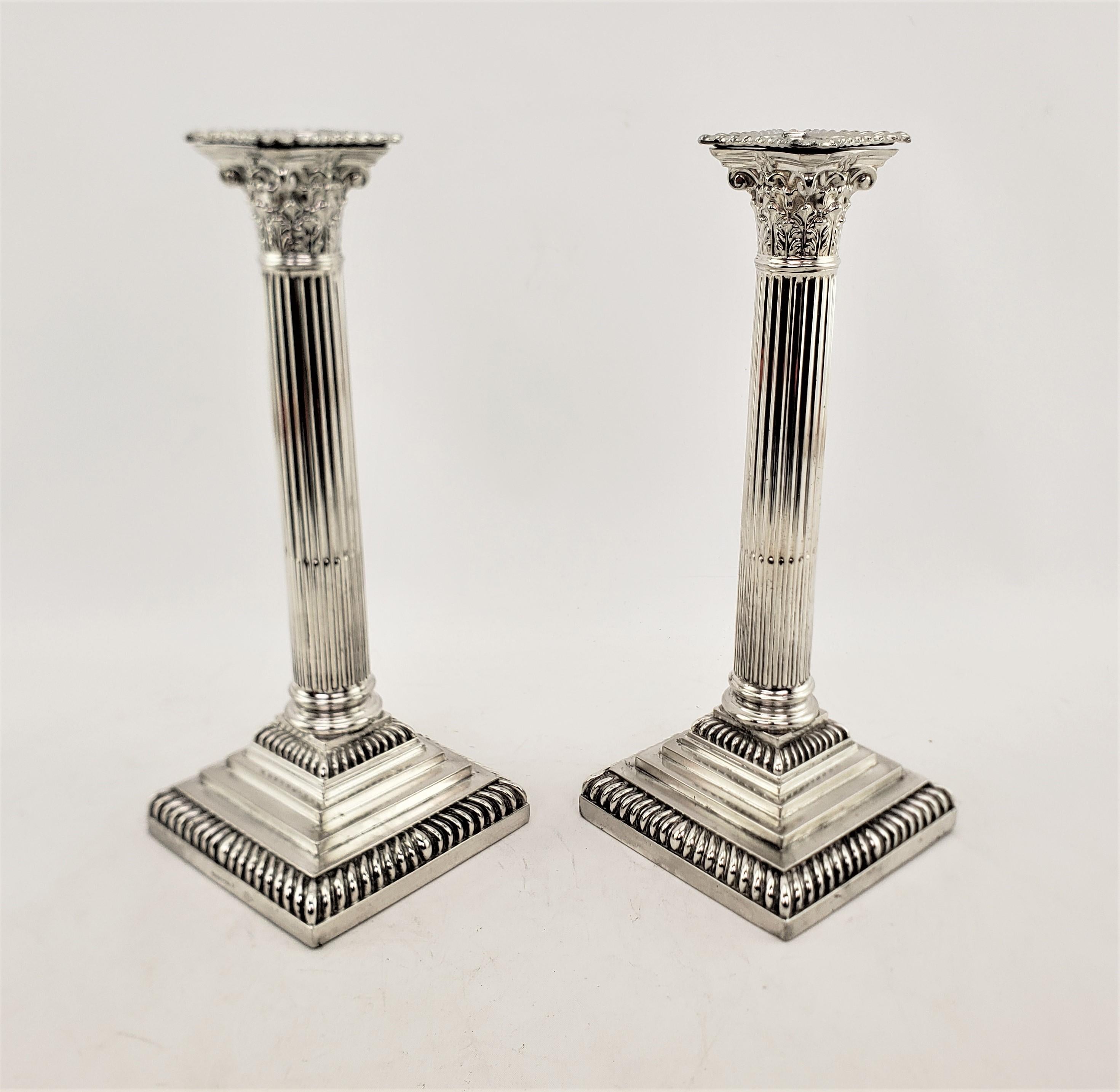 Machine-Made Pair of Antique English Silver Plated Candlesticks in a Corinthian Column Style For Sale