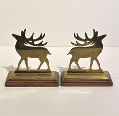Pair of Antique English Solid Brass "Reindeer" Chimney Ornaments on Oak Stands..