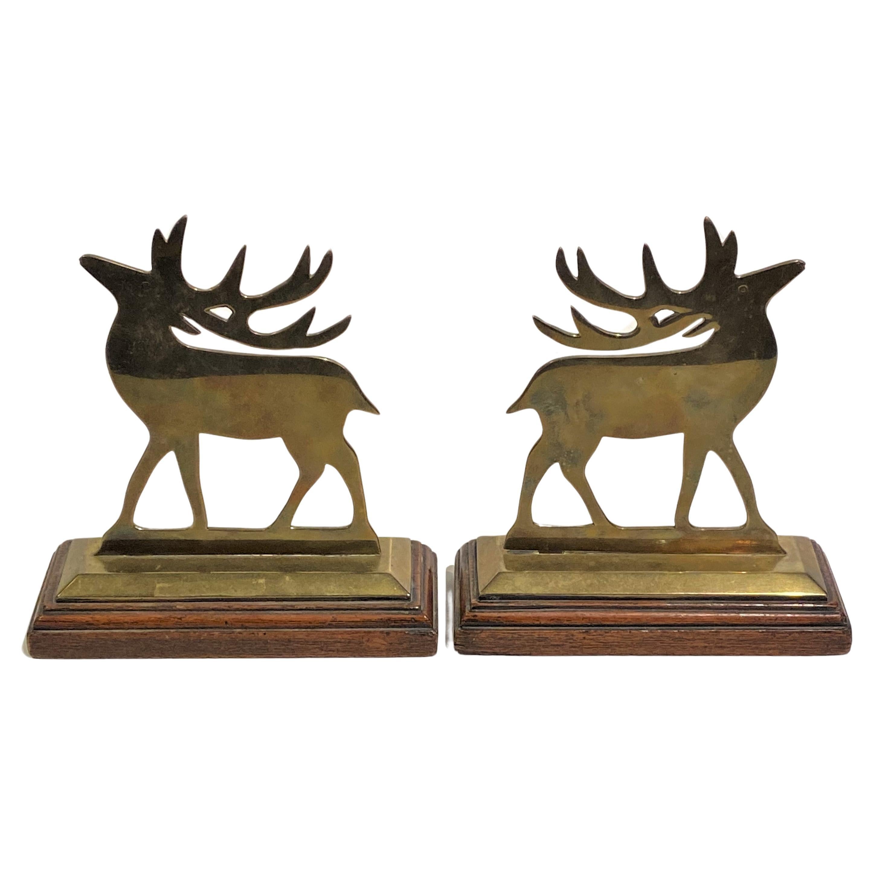 Pair of Antique English Solid Brass "Reindeer" Chimney Ornaments on Oak Stands.. For Sale