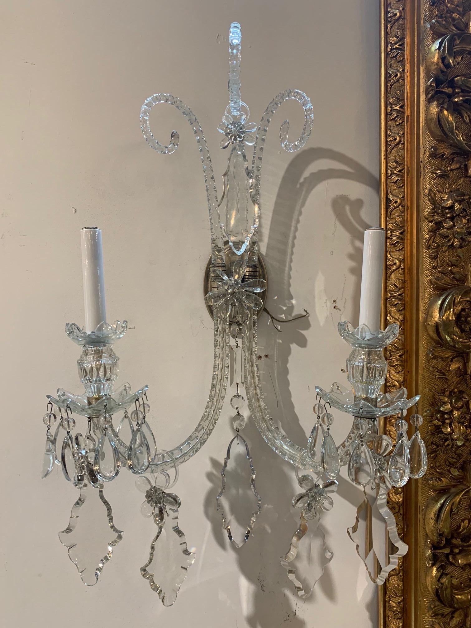 Lovely pair of antique English Waterford style crystal wall sconces with 2 lights. Large dangling crystals and nice scale and shape on these. So pretty!!