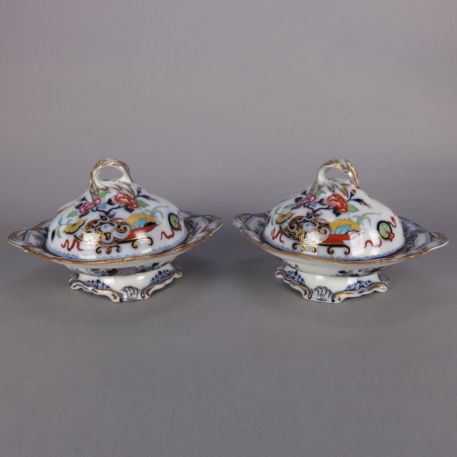 Pair of antique English Wedgwood Noma pattern ironstone tureens feature polychromed, flow blue and gilt Asian floral and urn decoration, one en verso marked NOMA 4314 with the other marked 4317, mid-1800s.

***DELIVERY NOTICE – Due to COVID-19 we