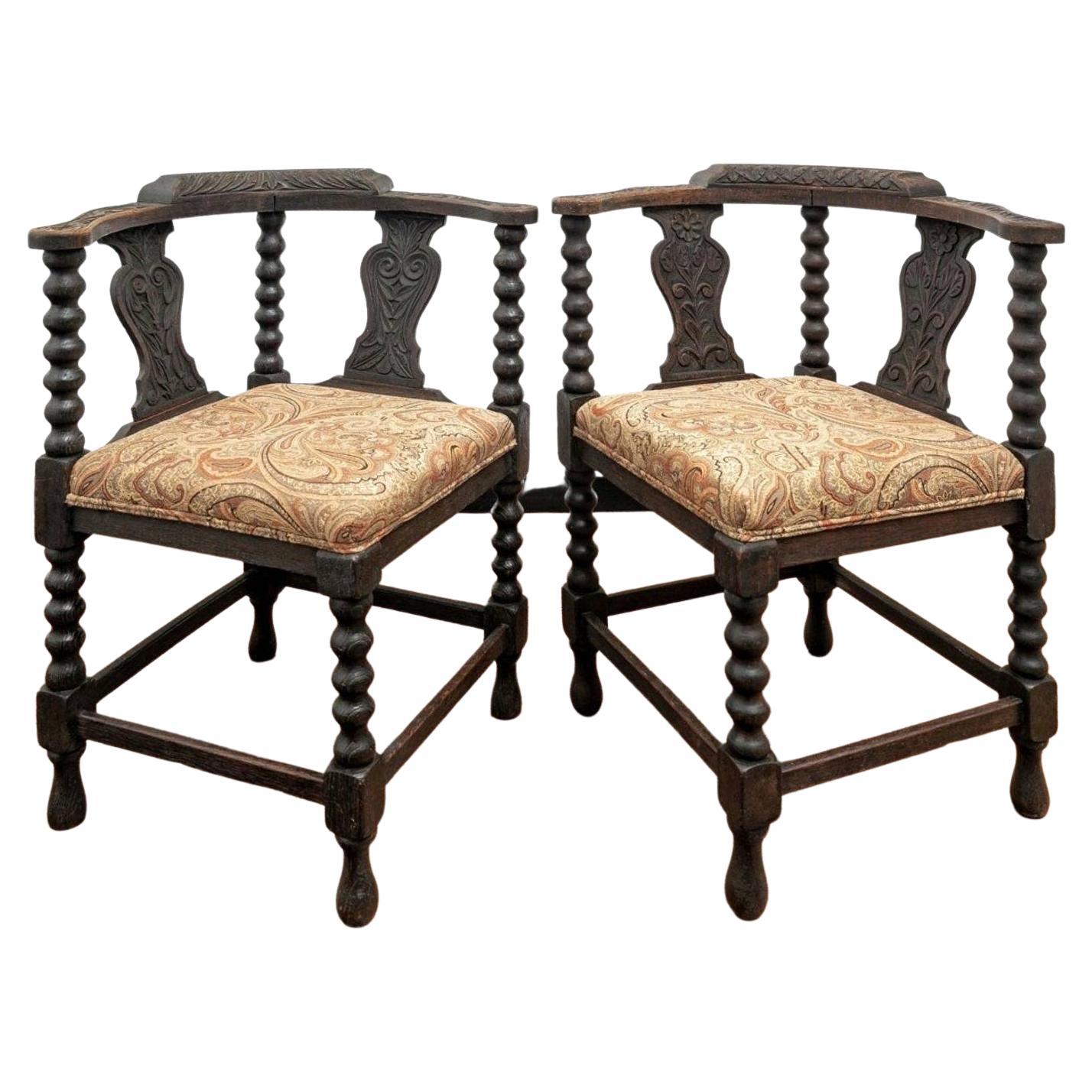 Pair of Antique European Carved Oak Corner Chairs For Sale