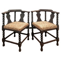 Pair of Used European Carved Oak Corner Chairs