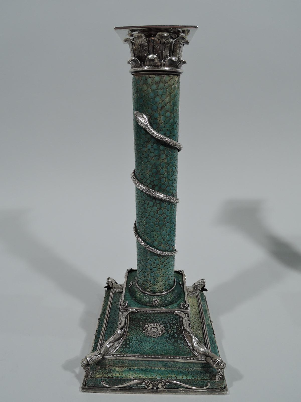 Pair of European shagreen and silver candlesticks, circa 1880. Each: Column on raised square base covered with green-tinted shagreen. Silver Corinthian capital with square beaded socket. Column encircled with winding scaly snake. On base silver