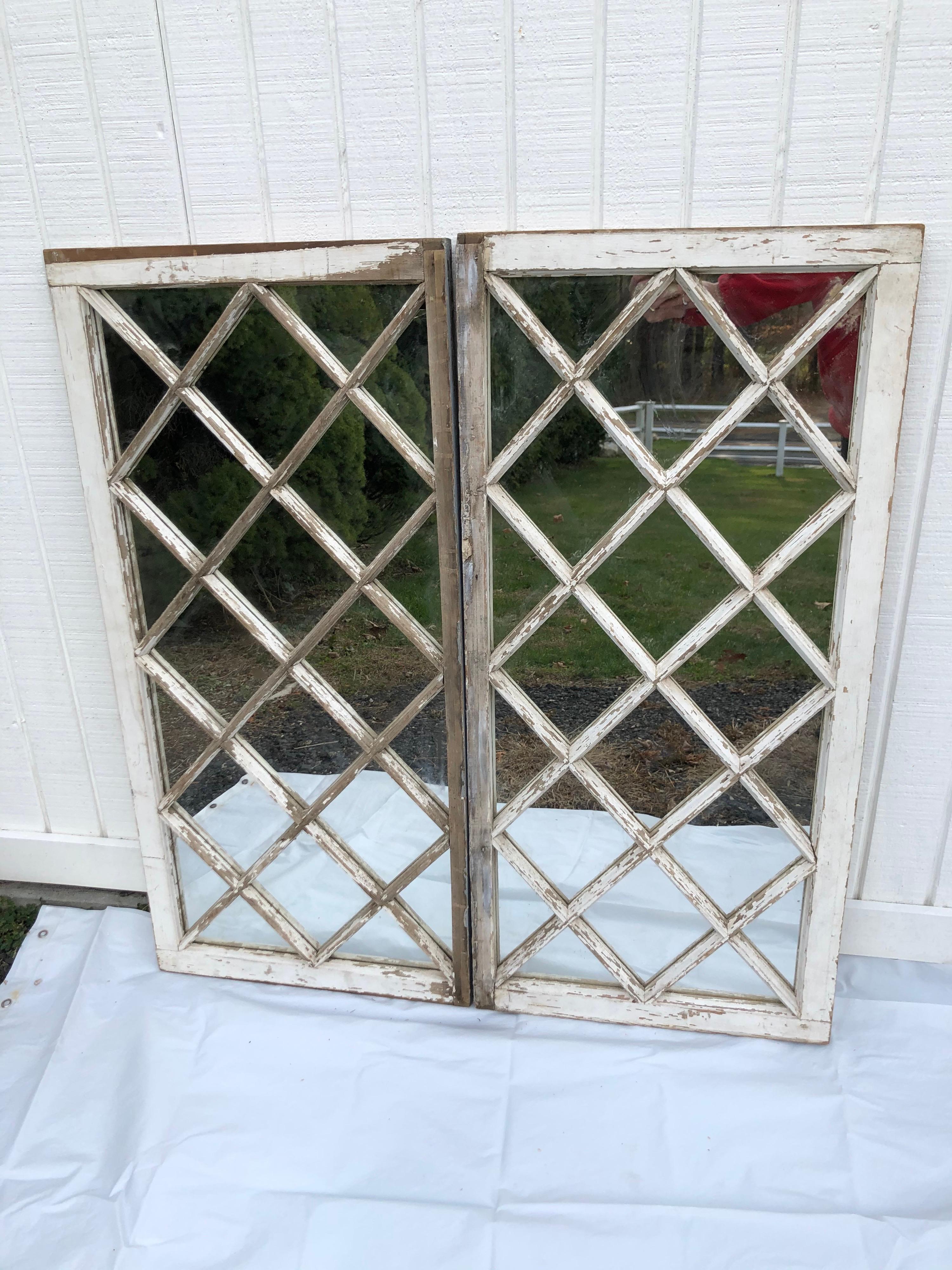 Pair of antique farm house shabby chic mirrored windows. Most likely Victorian era. Perfect for that country farmhouse look. Solid individual panes with white chippy paint. Ready to hang. Each window measures : 44