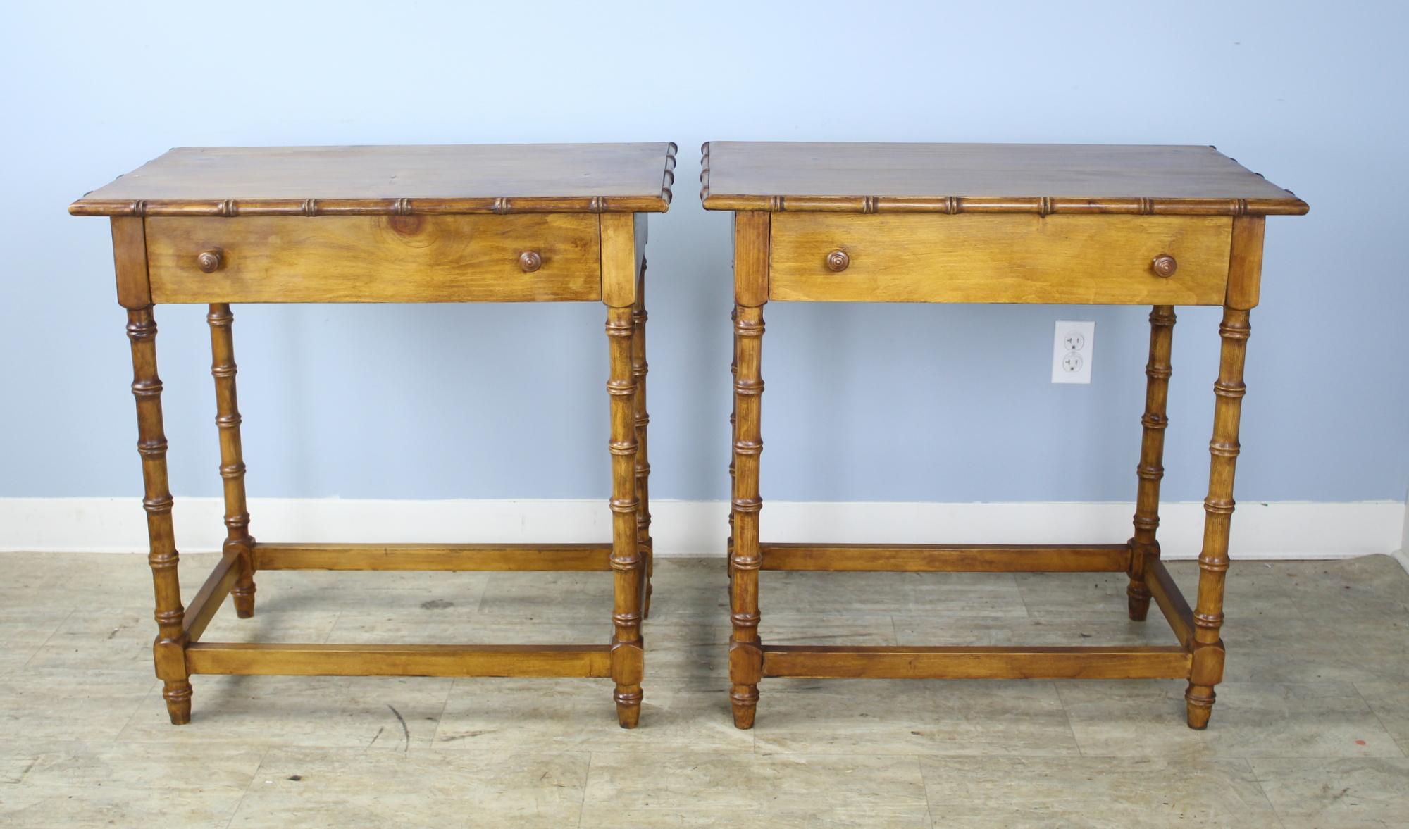 A matching pair of faux bamboo side tables in very good antique condition. Would do nicely as large nightstands.