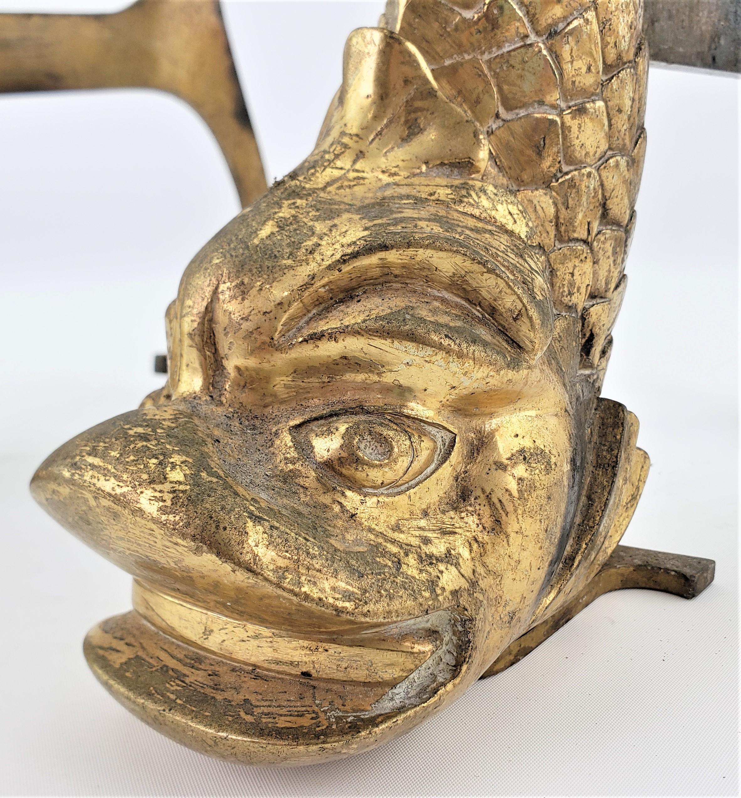 Pareja de antiguos morillos figurados de bronce dorado estilizados de delfín o pez en venta 2