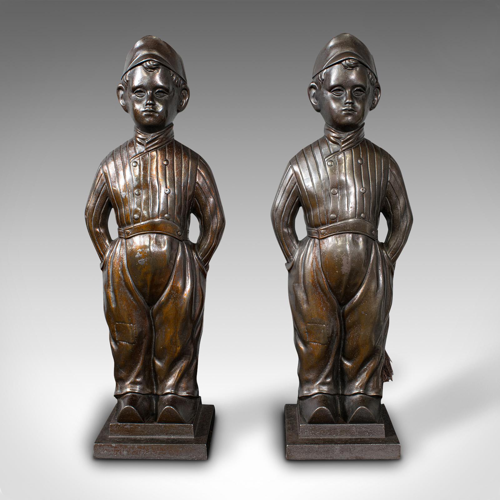 This is a pair of antique fireside boys. An English, cast iron fireplace companion with tools, dating to the early 20th century, circa 1920.

Delightfully charming tool rests, with copious appeal for the fireside
Displaying a desirable aged