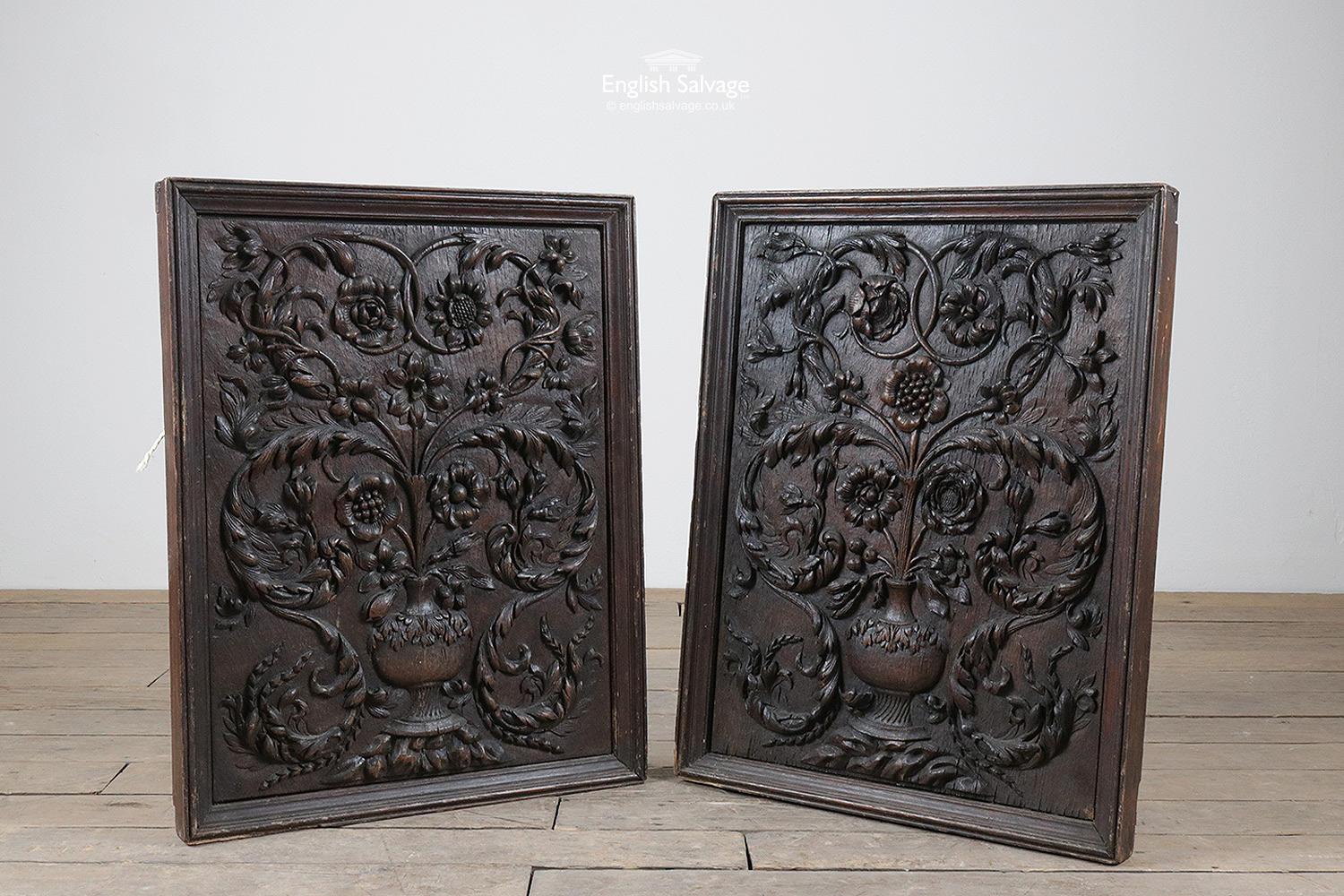 A lovely pair of very old hand carved oak panels depicting vases and an array of different flowers and foliate scrolls set in moulded frames. Beautiful and intricate detailing. Measurements given are the maximum overall, the thickness of the panels