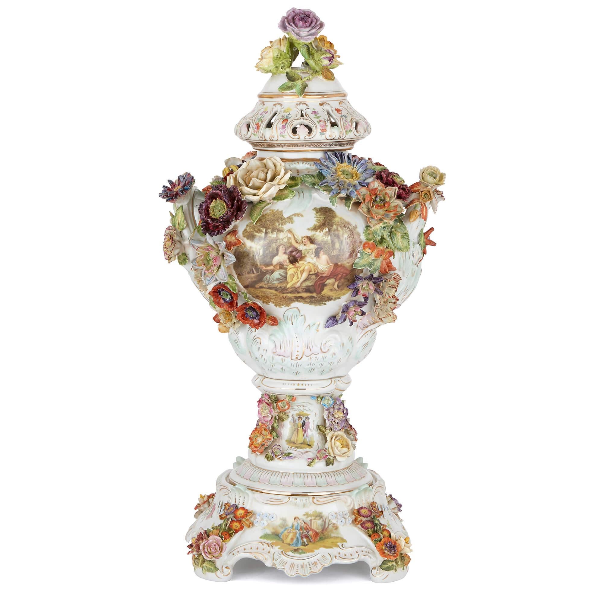 These ostentatious, lively vases are exceptional examples of the ceramicist's craft, set with intricate floral decorations as well as Rococo style cartouches. They are the work of the Carl Thieme Porcelain Manufactory in Dresden, probably the name