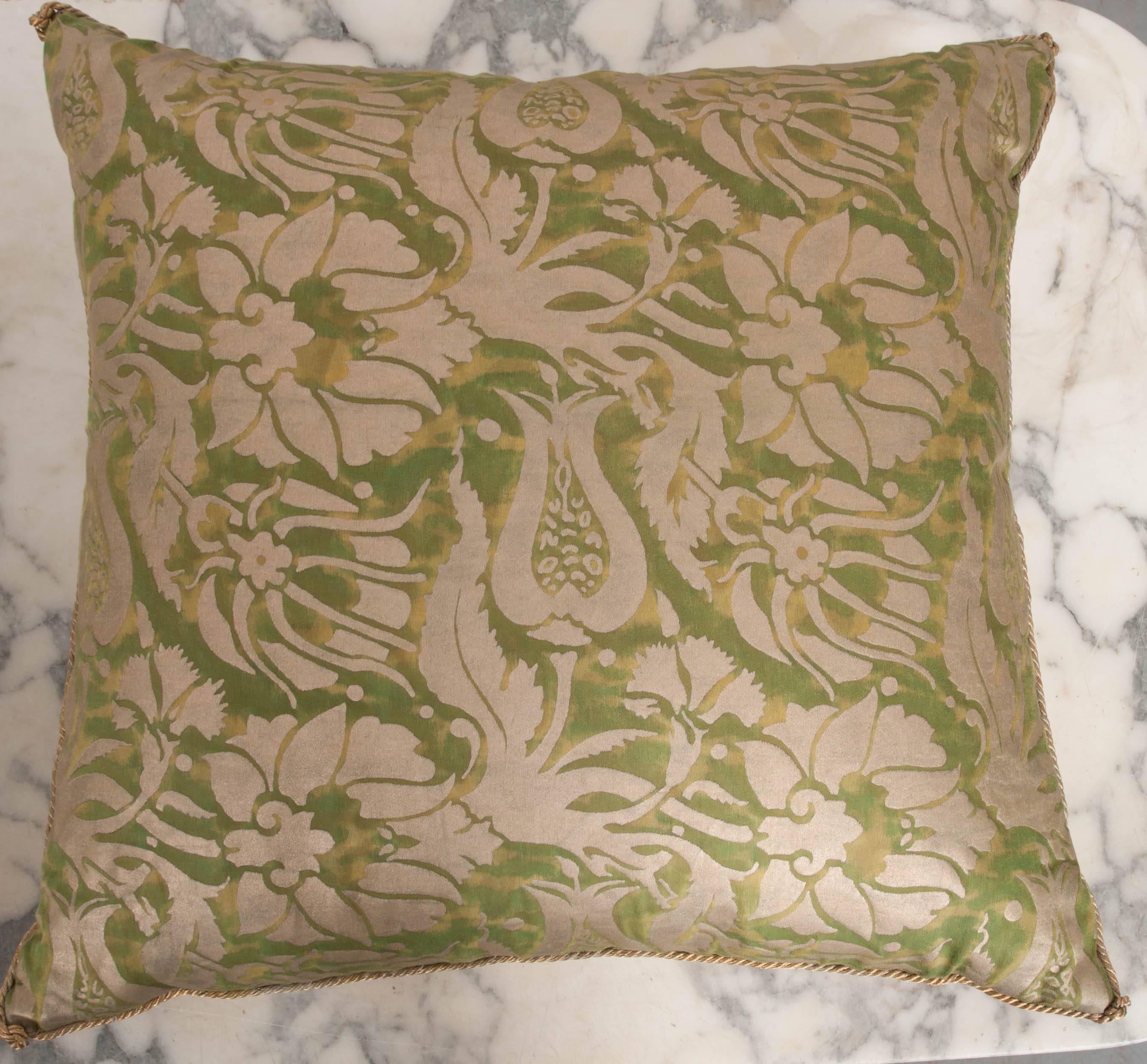 B.Viz designs pillow in bayou green and silvery gold Melagrana Fortuny, backed with warm pale taupe velvet. Hand trimmed gold metallic cording knotted in the corners. Down filled. Sold only as a pair.