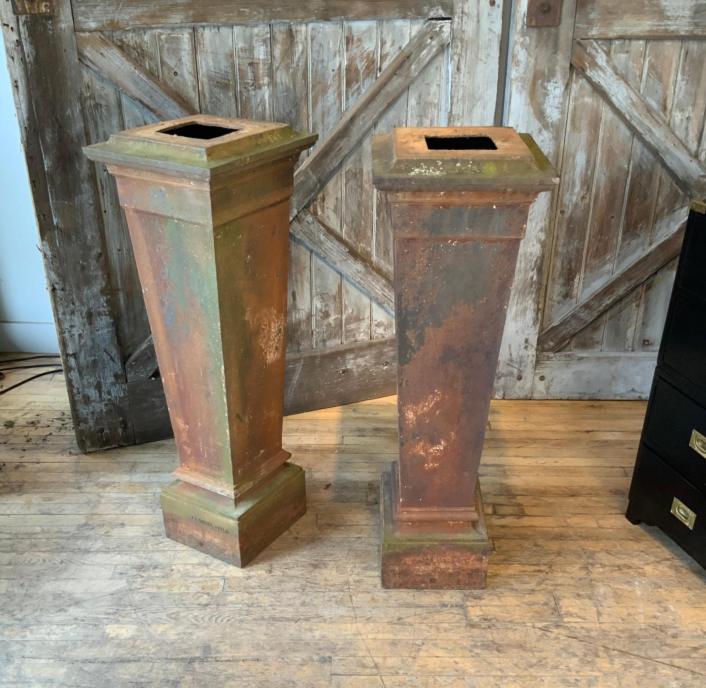 A very nice matched pair of 19th Century cast iron Pedestals by JJ Ducel et Fils. these french pedestals are tapered in form, with wide banded design bases and capitals. very heavy and well made. stamped JJ Ducel et Fils.