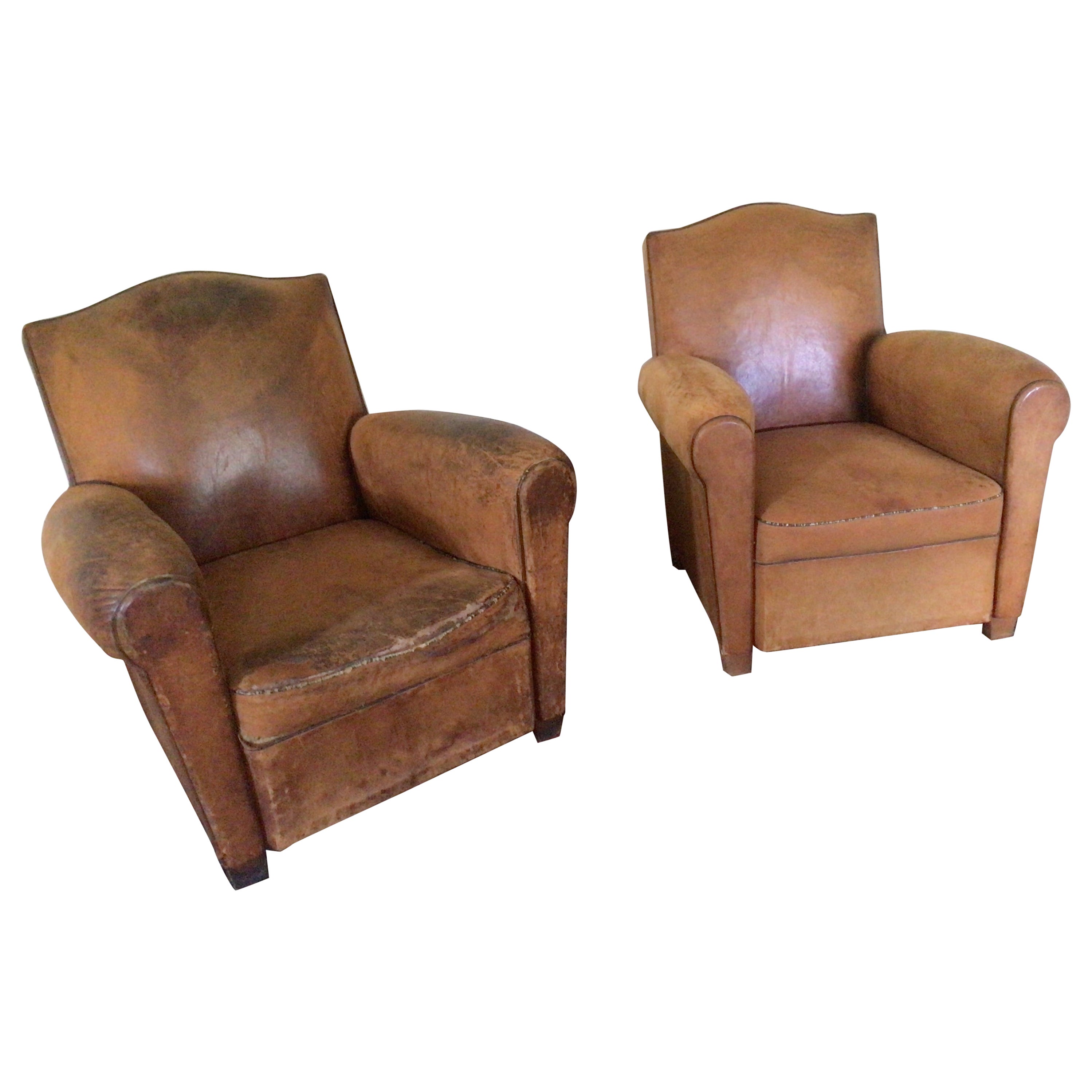 Paire de fauteuils club en cuir Art Déco français anciens.