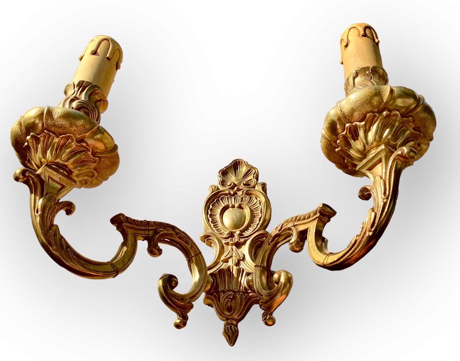 Pair Of Antique French Beau Arts Gilded Bronze Two Arm Electrified Wall Sconces In Good Condition For Sale In New Orleans, LA
