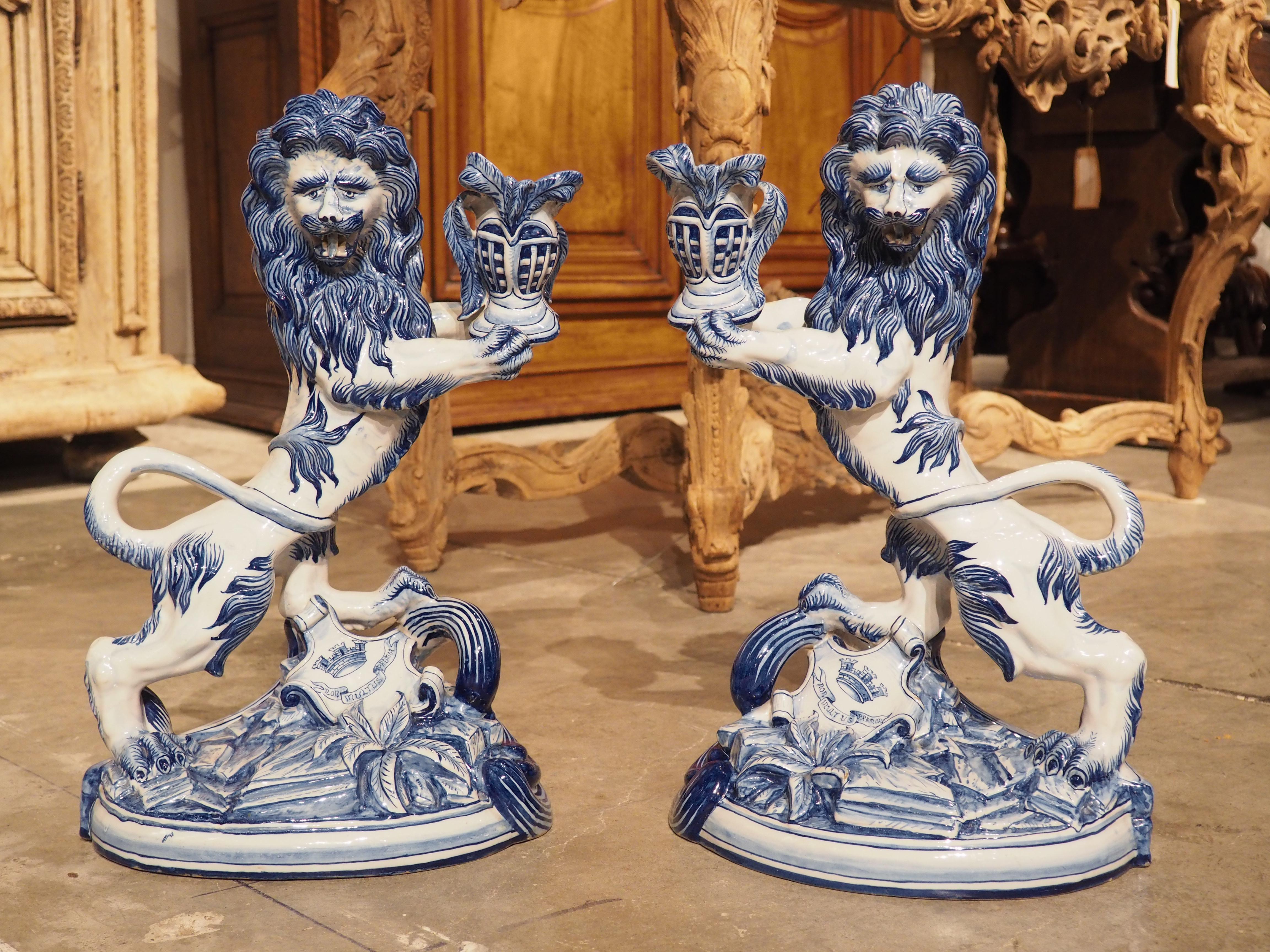 Hand-Painted Pair of Antique French Blue and White Saint-Clément Faience Lion Candle Holders For Sale