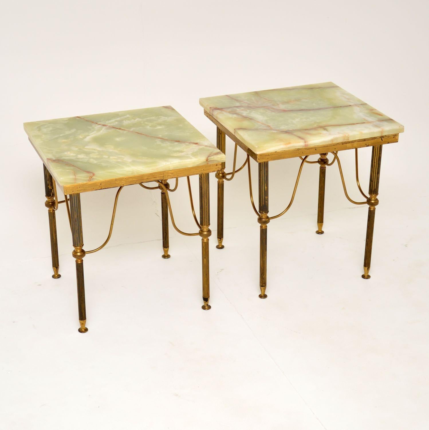 A stylish and extremely well made pair of vintage French Neoclassical style side tables in solid brass, dating from around the 1930-50’s.

The quality is excellent, the brass frames have fluted legs and beautifully shaped supports. The green onyx
