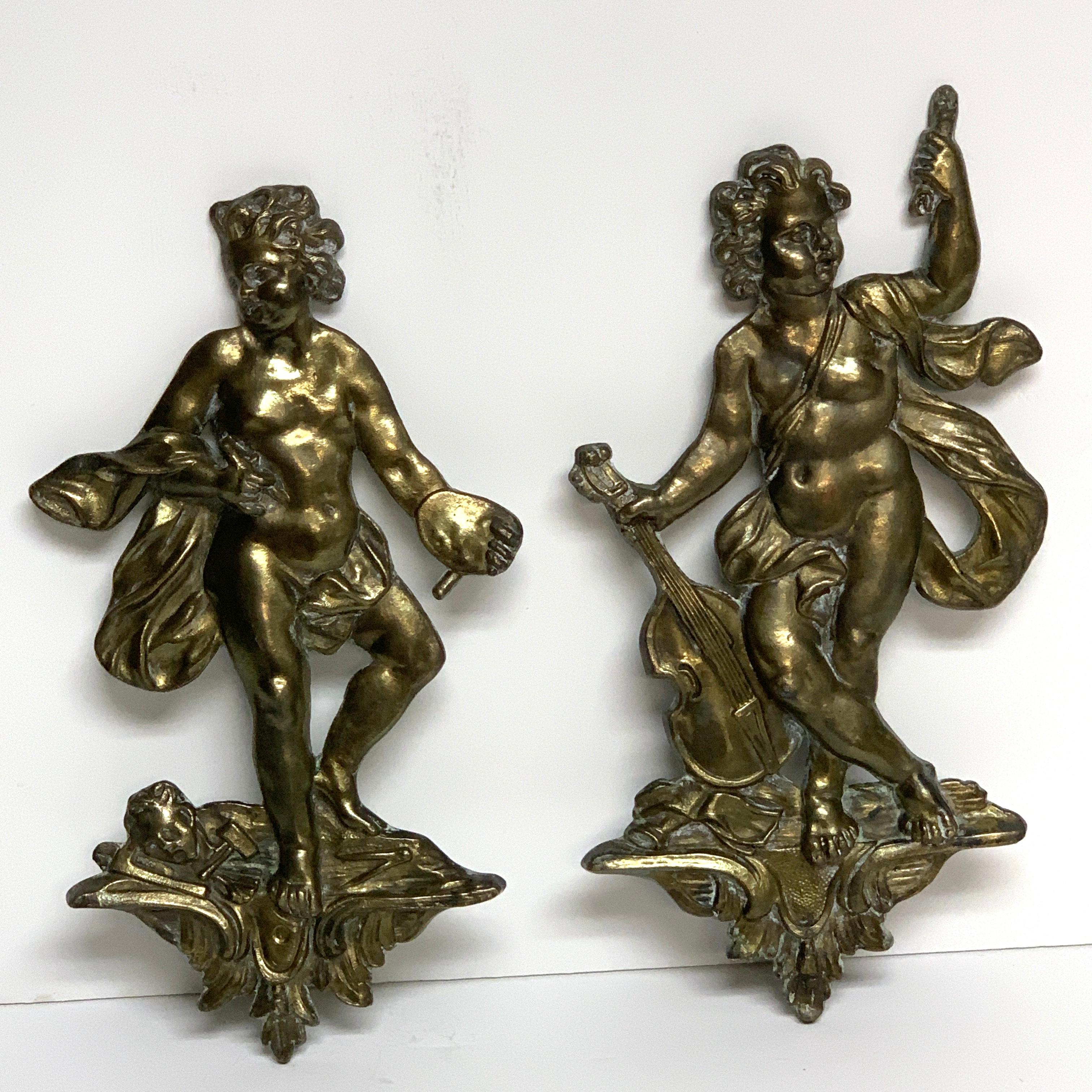Pair of antique French bronze appliqués depicting art and music, each one finely cast draped putto one holding an artists palette the other a lute.
Art measures: 10.5