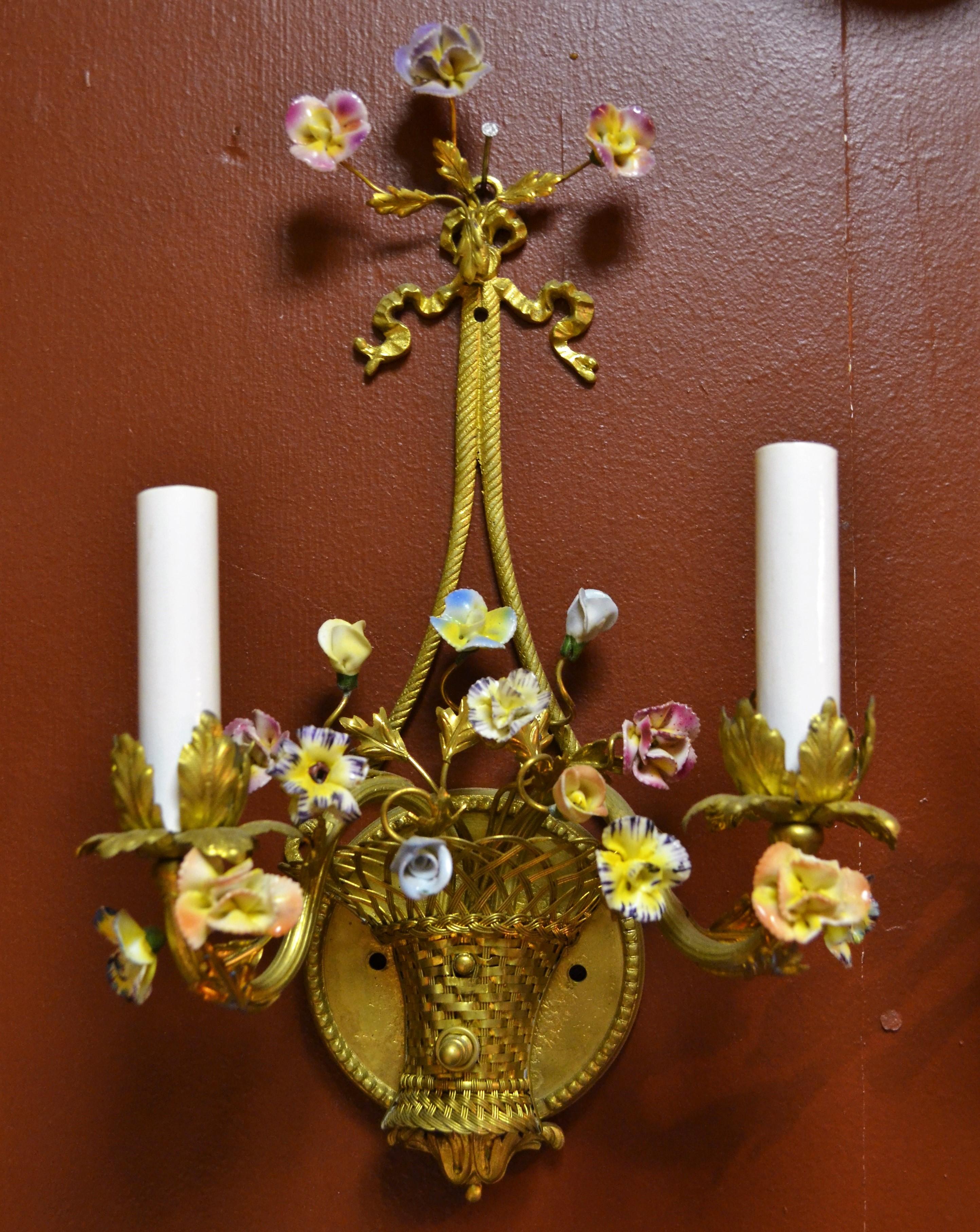 Charming little basket sconces with delicate flowers.