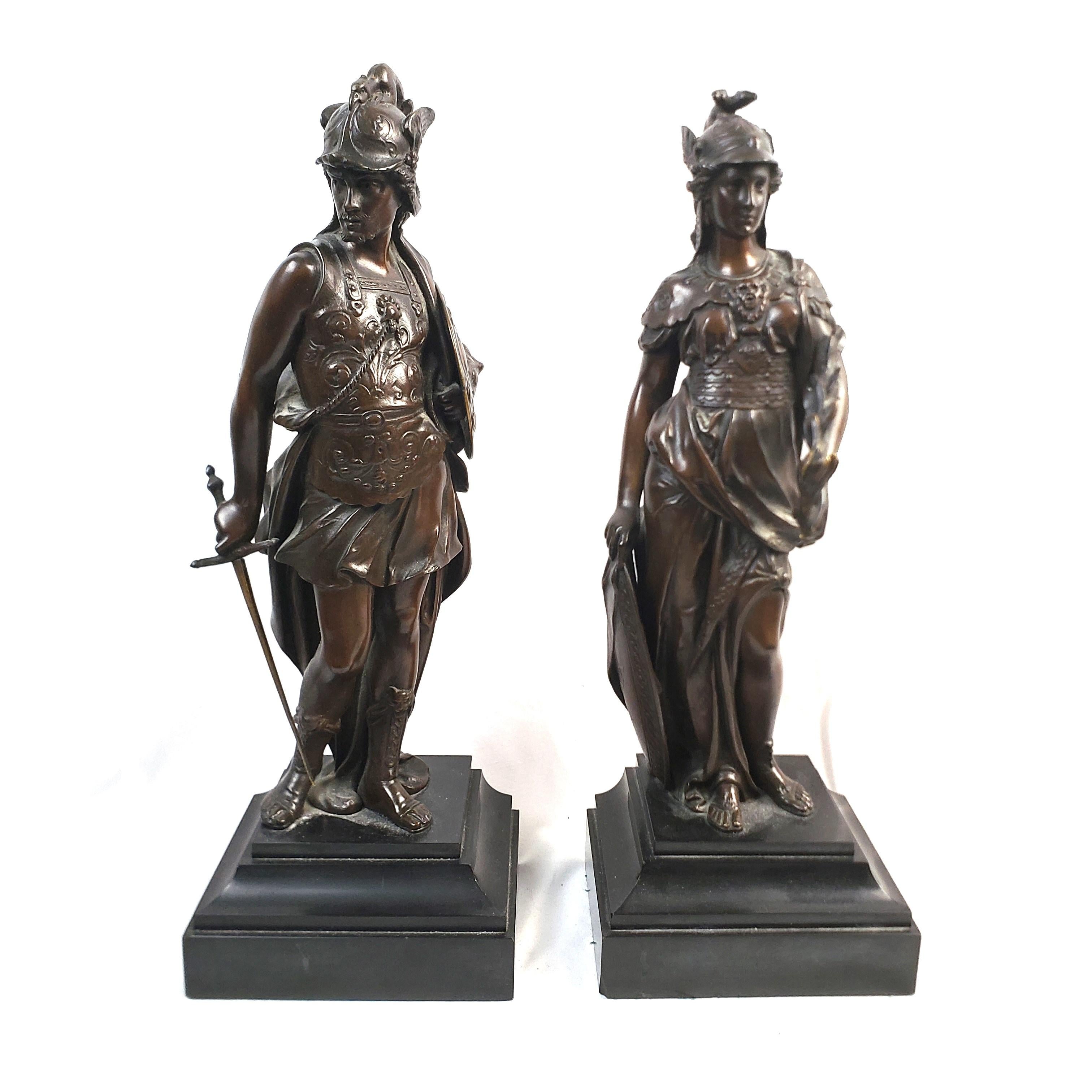 This pair of antique sculptures are unsigned, but presumed to have originated from France and date to approximately 1850 and done in a period Renaissance Revival style. The sculptures are composed of cast and patinated bronze and depict the two