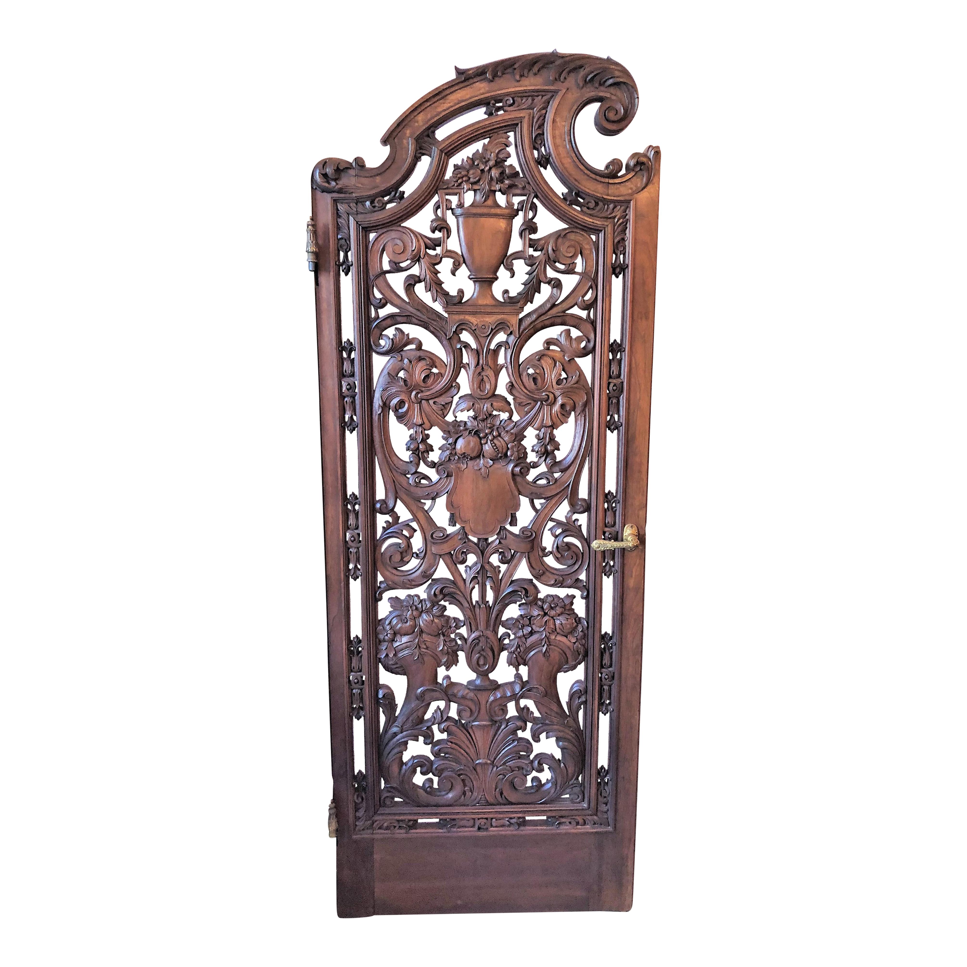 Pair of antique French carved walnut doors.