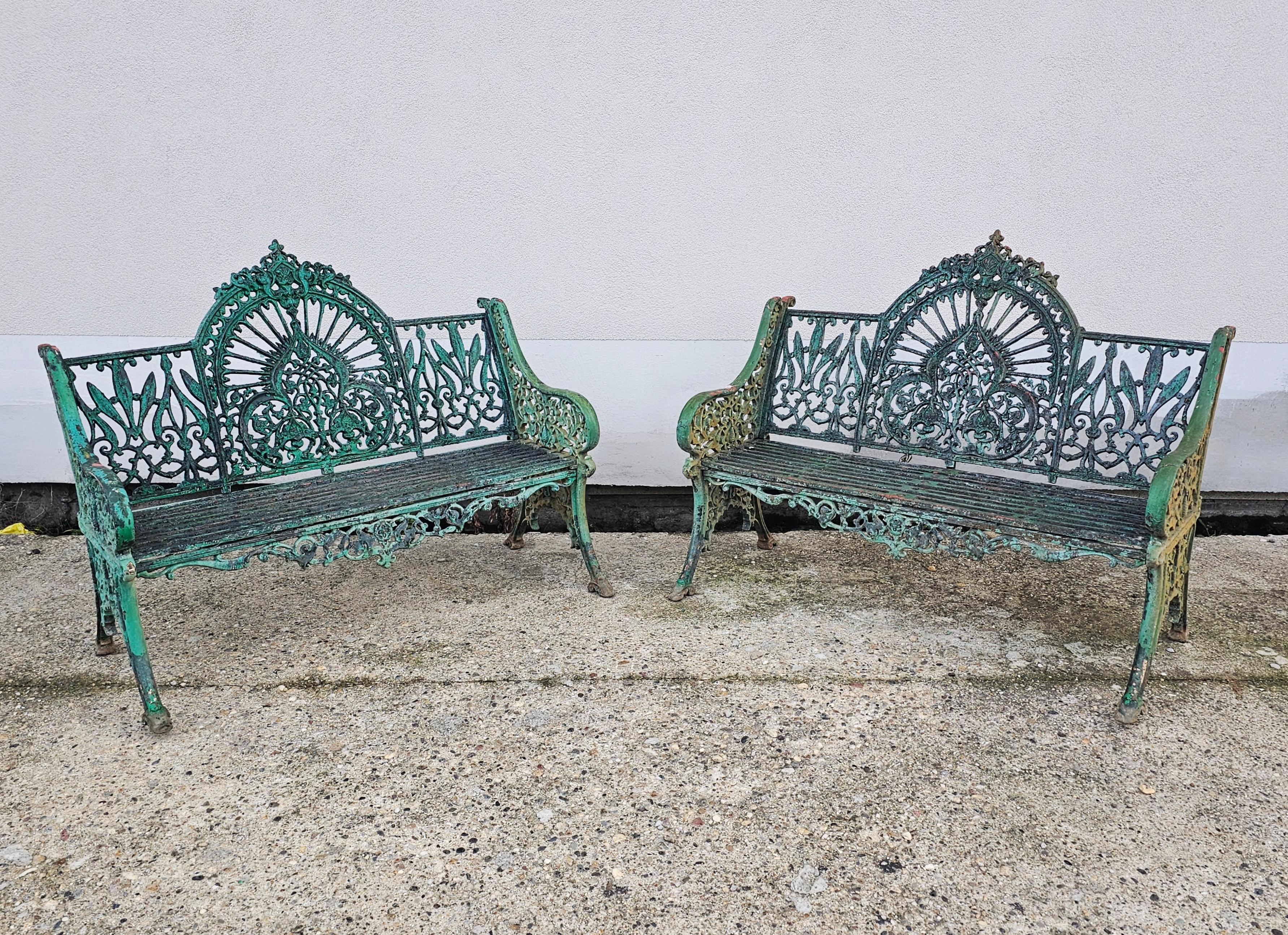 In this listing you will find a pair of French Antique Cast Iron garden benches. The Art Nouveau pattern they feature is often called the peacock bench. Due to the cast iron slats, they will require little or no maintenance. Benches feature original