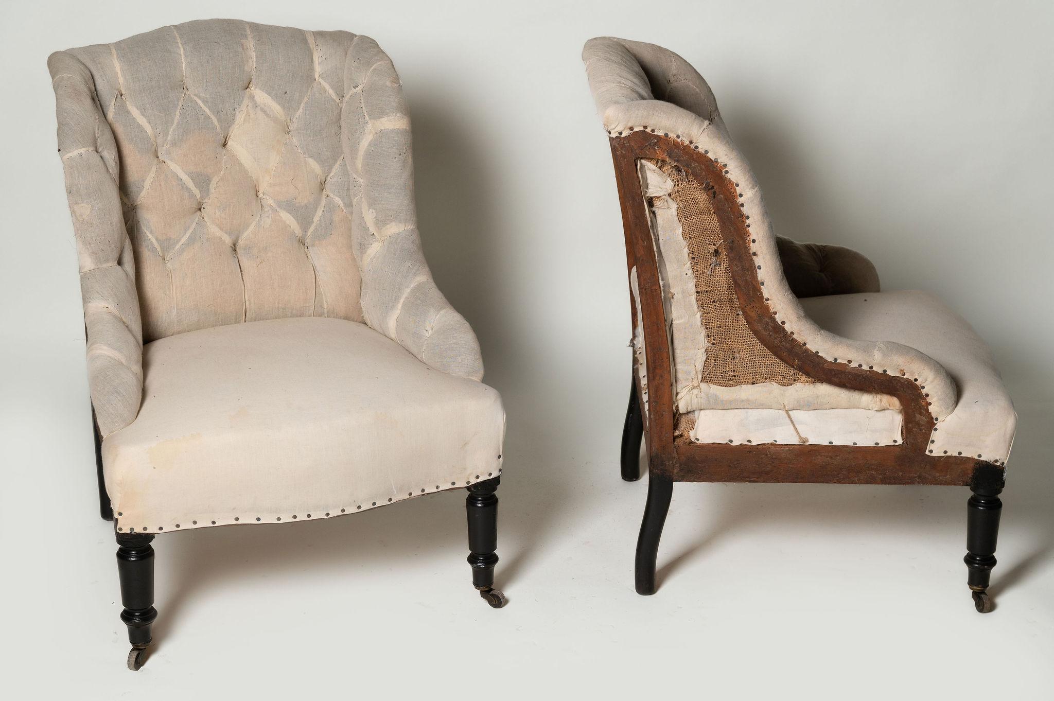 Small pair of antique French chairs, perfect size for any space. Ideal fireside, bedroom chairs or occasional seating. Unusual shape. Your upholsterer could upholster them with or without the buttons. Seat depth 18.5 inches.

Width: 23 
