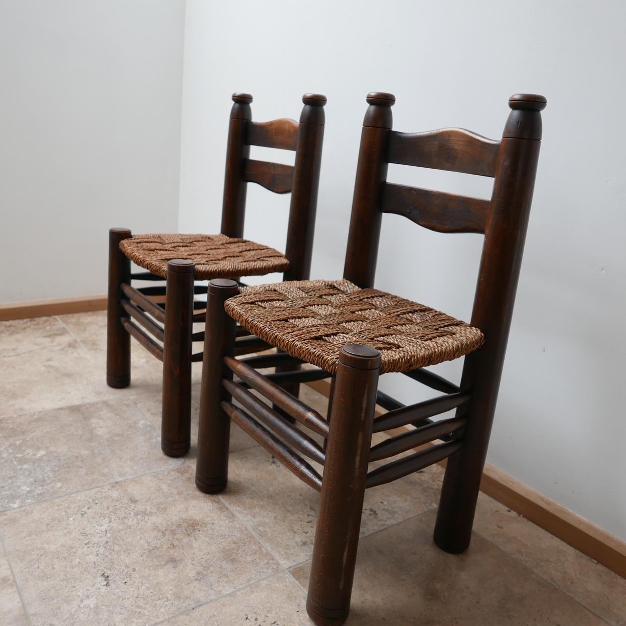 A pair of occasional chairs or dining chairs attributed to Charles Dudouyt. 

France, c1930s. 

Wildy stylish triple stretchers. Good condition corded rope seats. 

Perfect straddling a mantelpiece or as bedroom chairs.

Price is for the