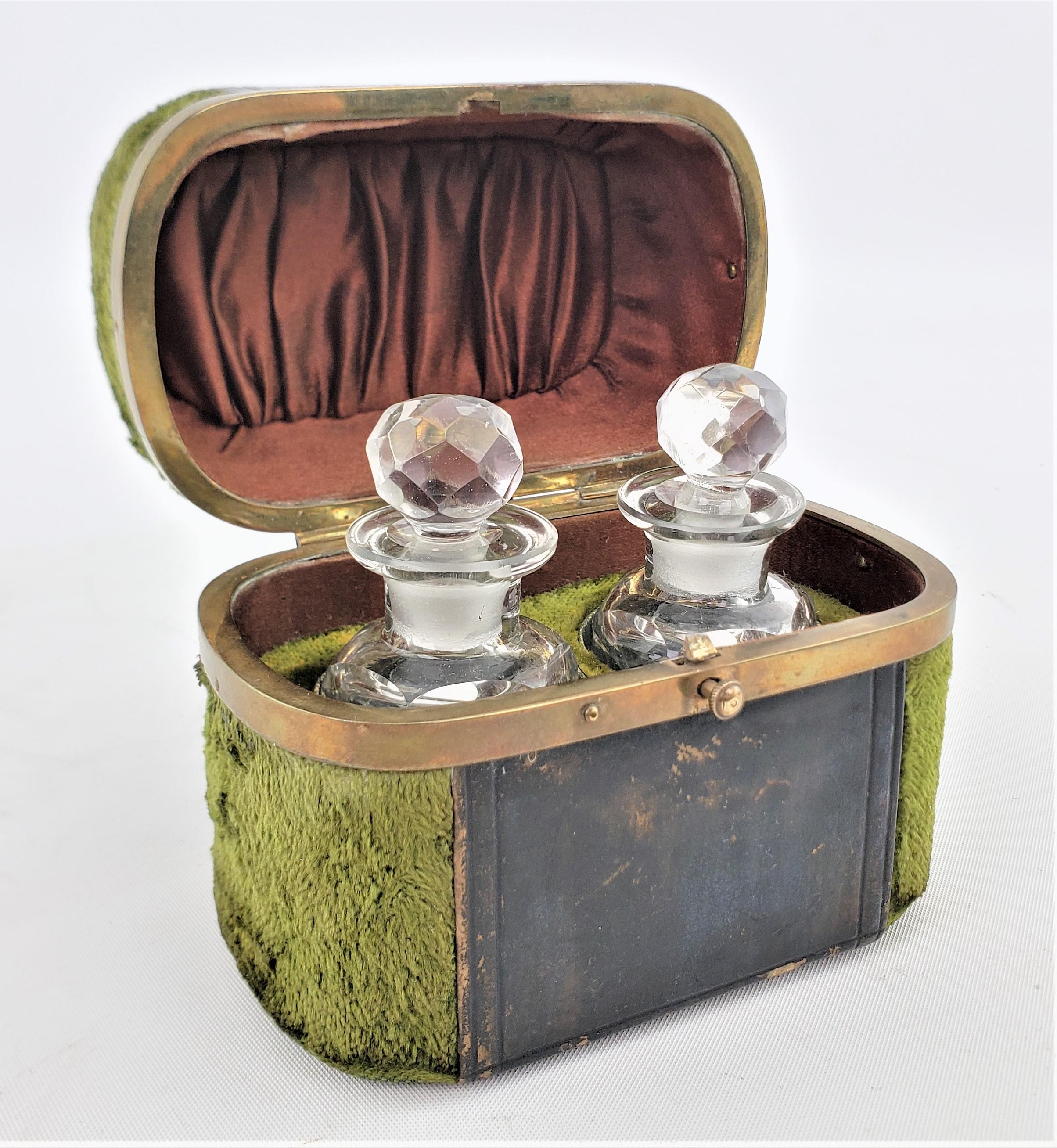 This antique set of glass perfume or scent bottles with a fitted case are unsigned, but presumed to have originated from France and dating to approximately 1880 in the period Louis XVI style. The bottles are composed of clear glass with faceted