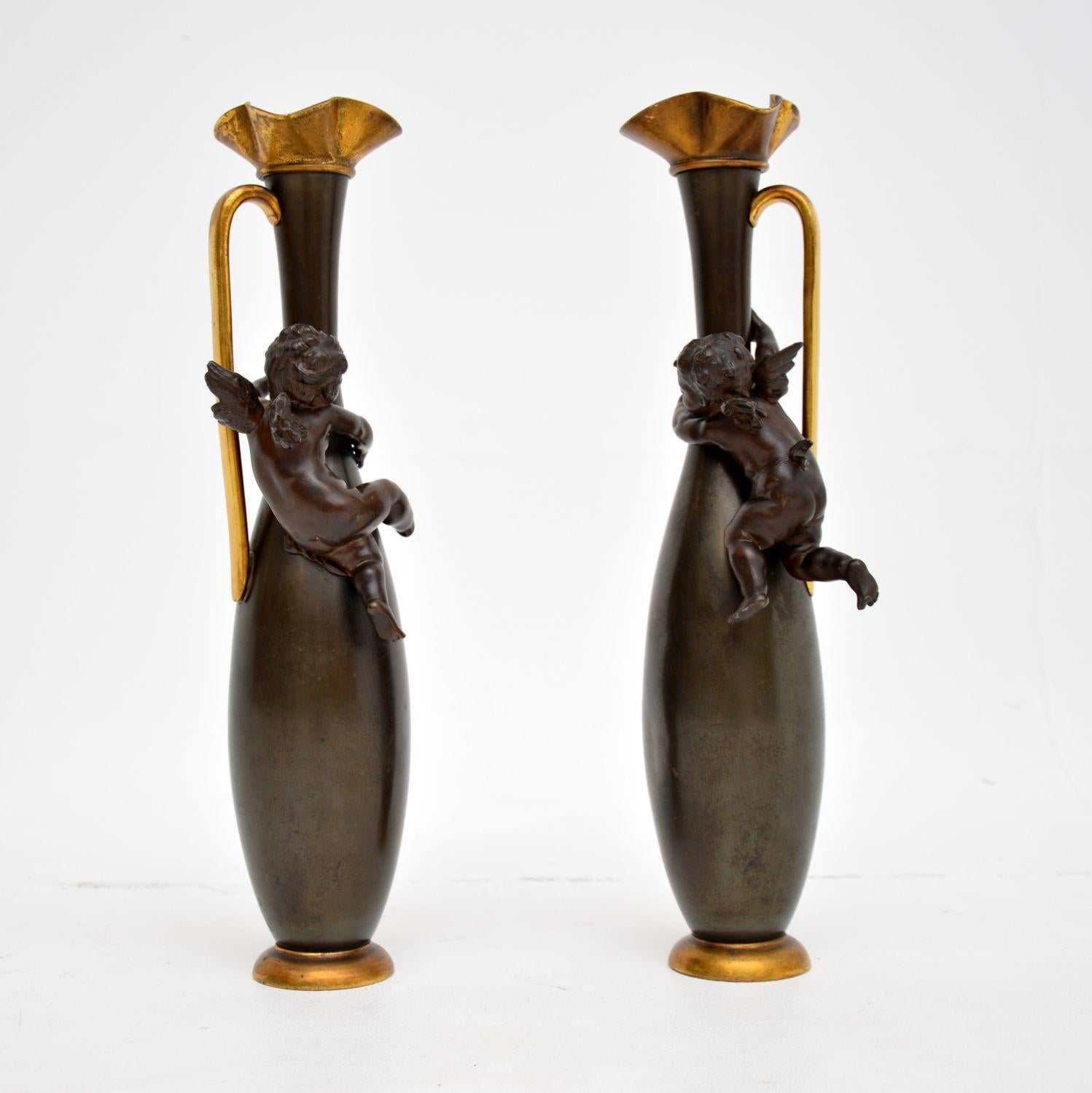 A gorgeous pair of antique French solid bronze pitchers. They were made in France, and date from around the 1890-1900 period.

They are of stunning quality, and are purely decorative as there is no opening at the top to store anything inside. They