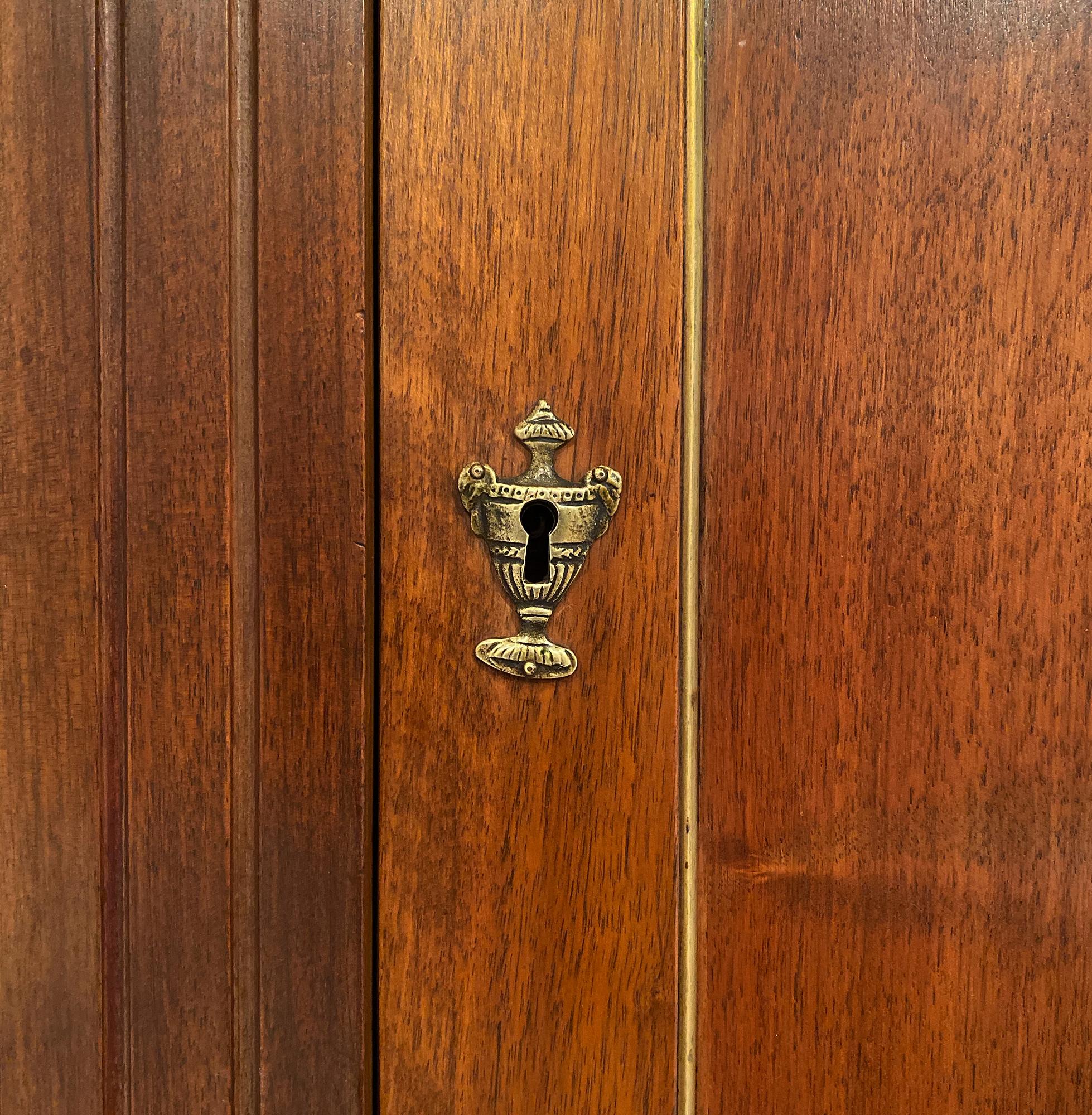 Pair of antique French Directoire buffets from a restaurant in the Rhone Valley. The buffets are in great condition and made of solid blond walnut. We love the gilt brass trim and hardware; as well as bronze “sabots” front feet. Each has three