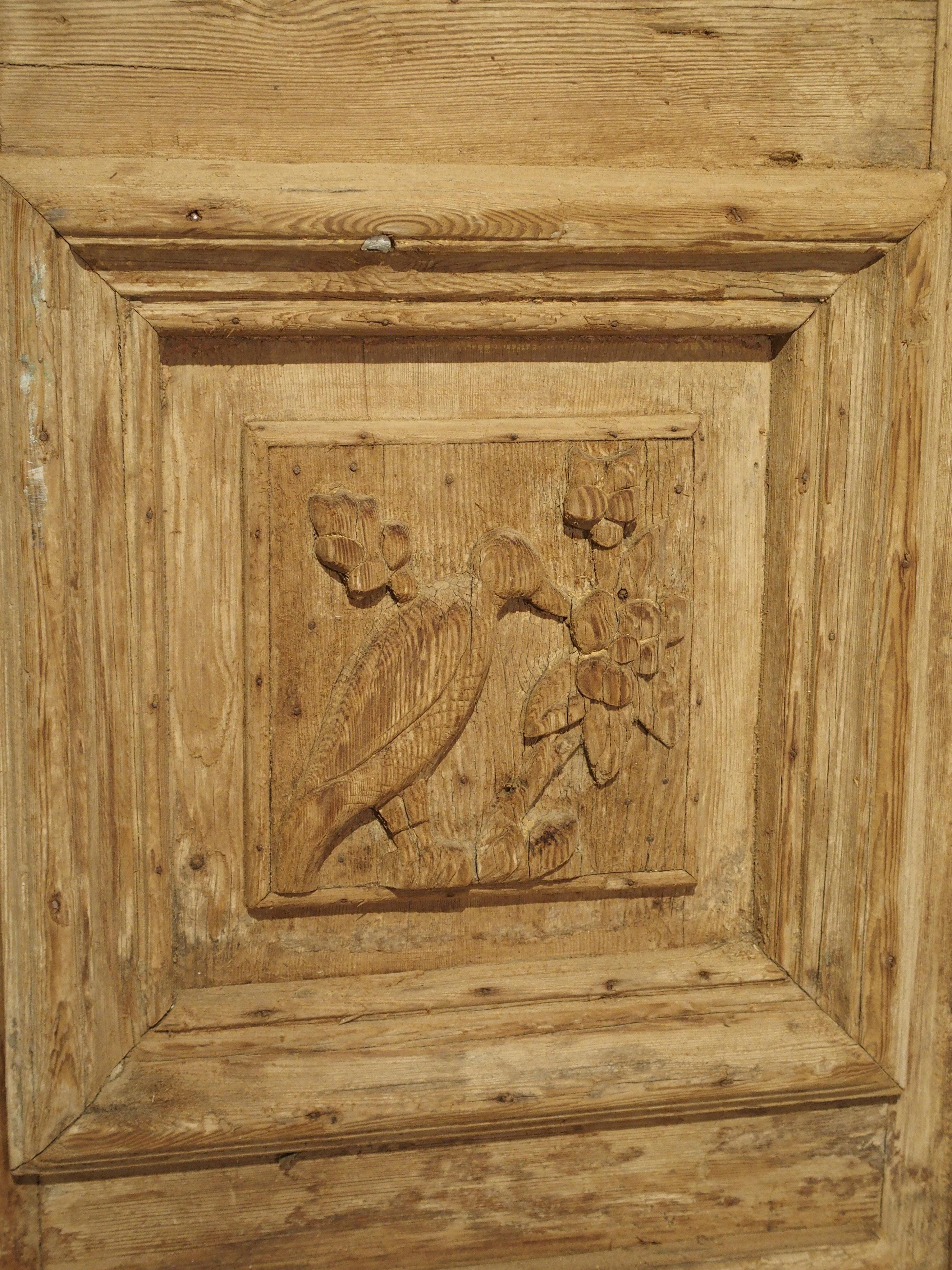 Pair of Antique French Egyptian Pine Doors with Carved Bird Motifs In Good Condition In Dallas, TX