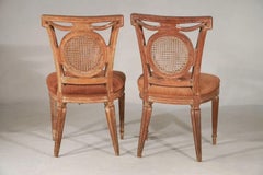 Pair of antique French fruitwood carved side chairs, 19th century