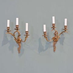 Pair of antique French gilt brass Rococo wall lights
