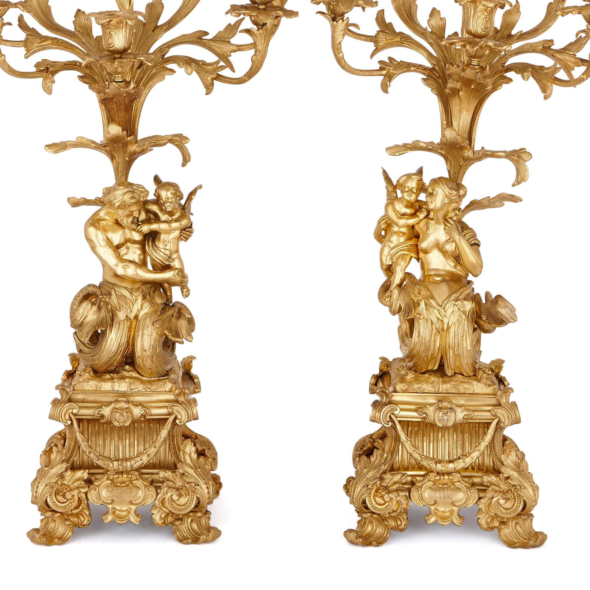 These wonderful large candelabra are lavish pieces of design, carefully-cast in bronze and elegantly finished with rich gilding. They are splendid examples of Napoleon III-era craft, a period associated with the return of opluence and magnificence