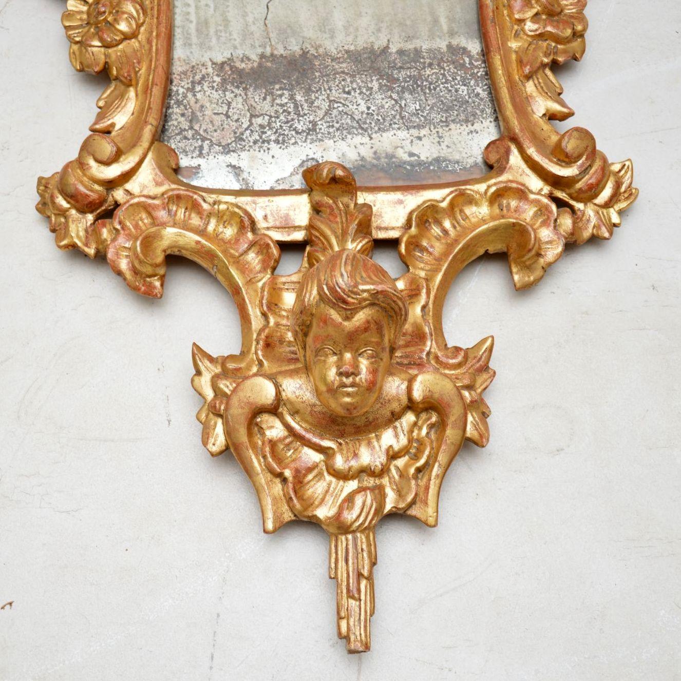 Stunning pair of antique French or Italian giltwood mirrors in very good original condition & with magnificent carved details all-over.

Please enlarge all the images to see the quality of the carvings, the original finish of the gilding & the