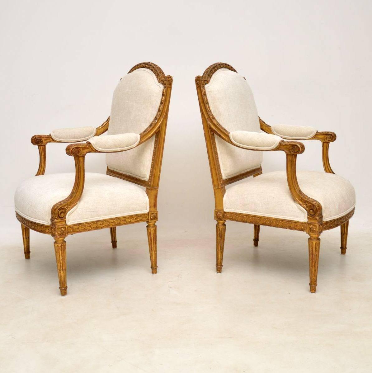 This pair of French antique giltwood armchairs are wonderful quality and in excellent original condition. They have very generous proportions and have just been re-upholstered in a neutral fabric. The frames are beautifully carved all-over and the