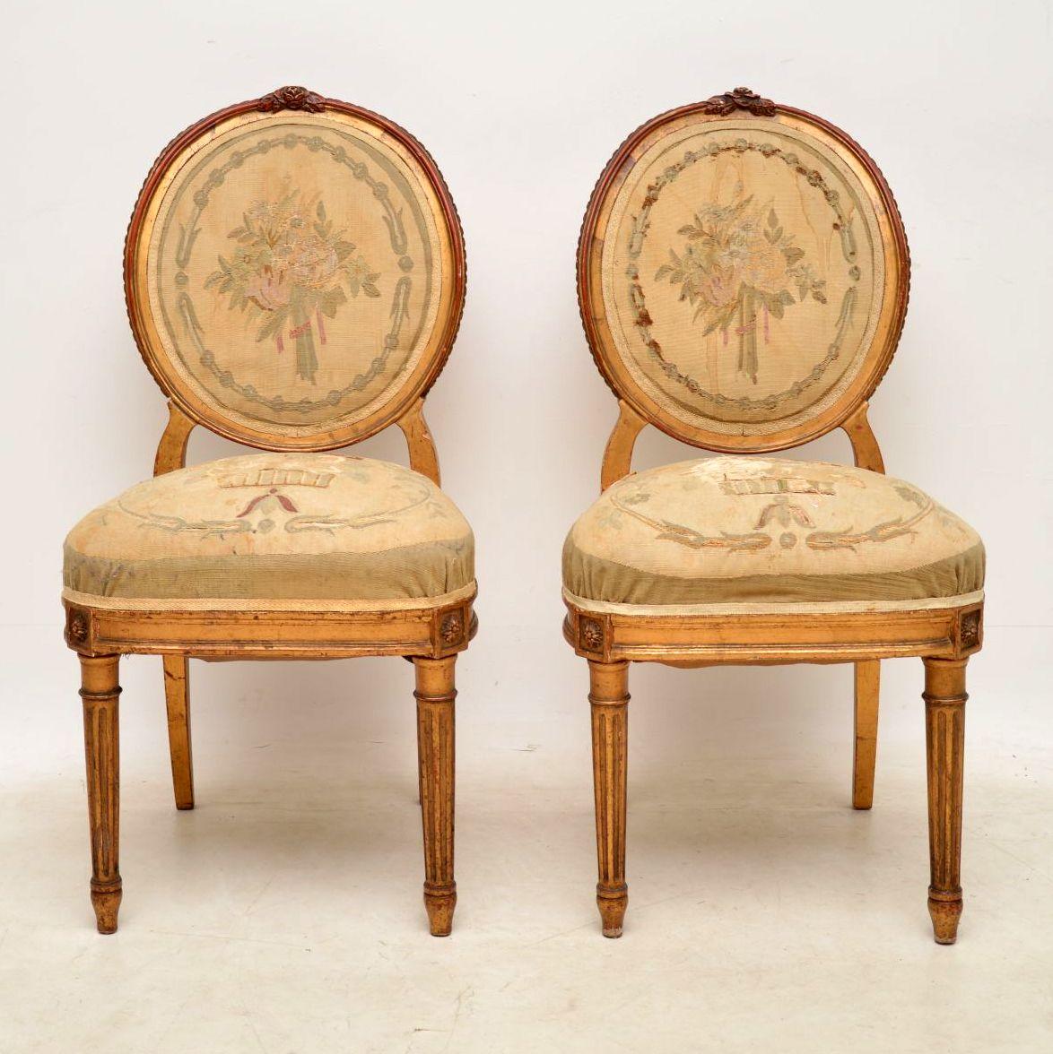 This pair of antique French giltwood side chairs are in great shape, besides the original upholstery. They are part of a whole set being sold on this site, including a sofa and matching pair of salons. There is an image of the complete set below and