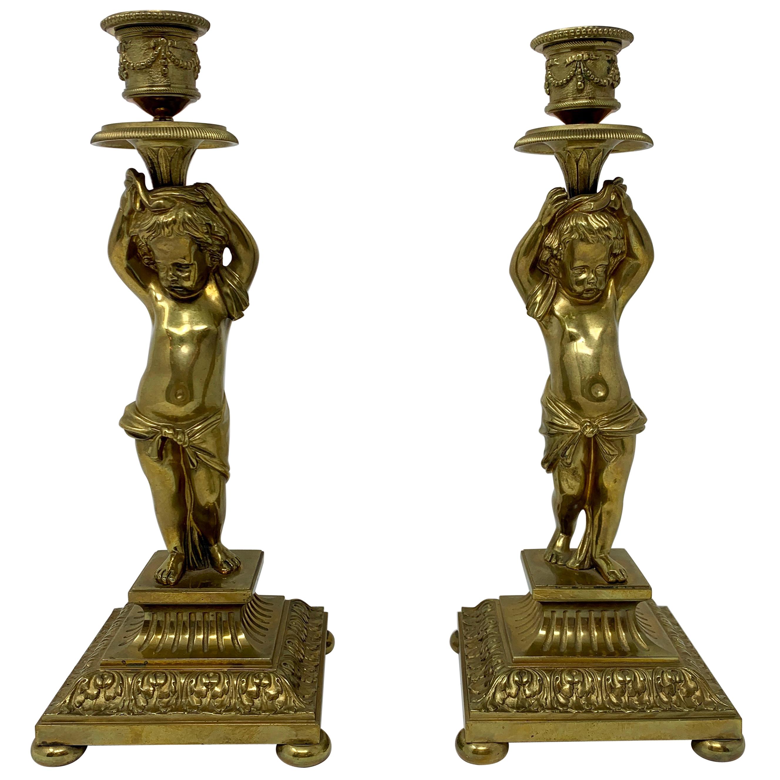 Pair of Antique French Gold Bronze Cupid Candlesticks For Sale