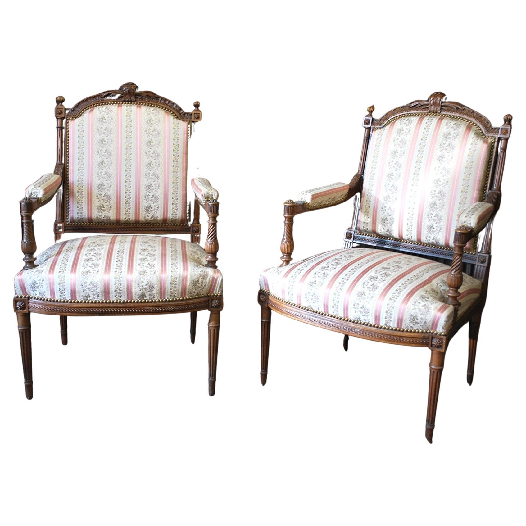 Hutton-Clarke Antiques is delighted to present an exquisite pair of Antique French Henri II Walnut Armchairs, dating back to approximately 1890. These chairs are a testament to the impeccable craftsmanship of their era, showcasing exceptional