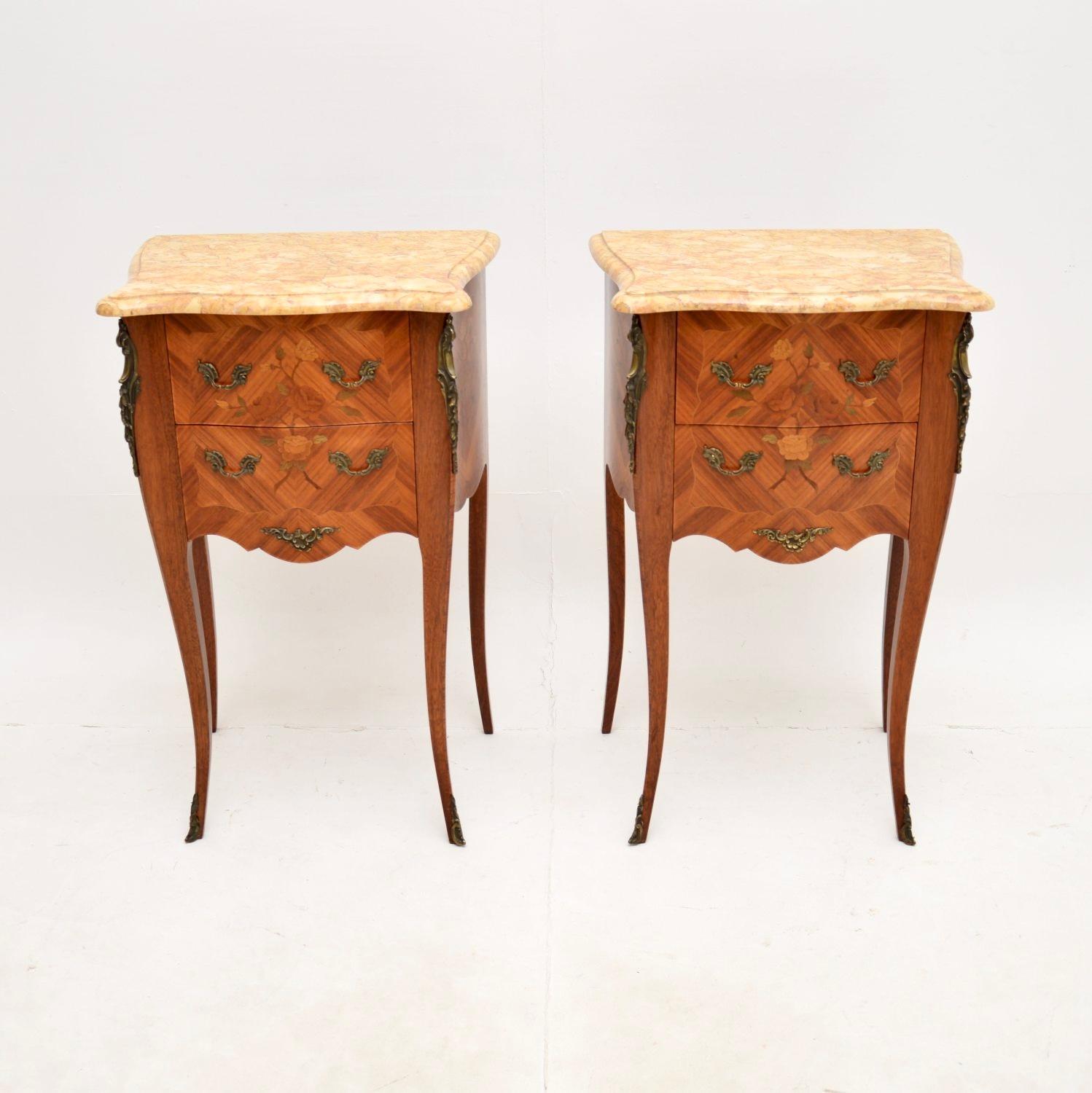 A stunning pair of antique French inlaid marble top bedside chests. They were made in France and date from around the 1900-1920 period.

The quality is fantastic, they have an elegant yet sturdy design. There are high quality ormolu mounts and