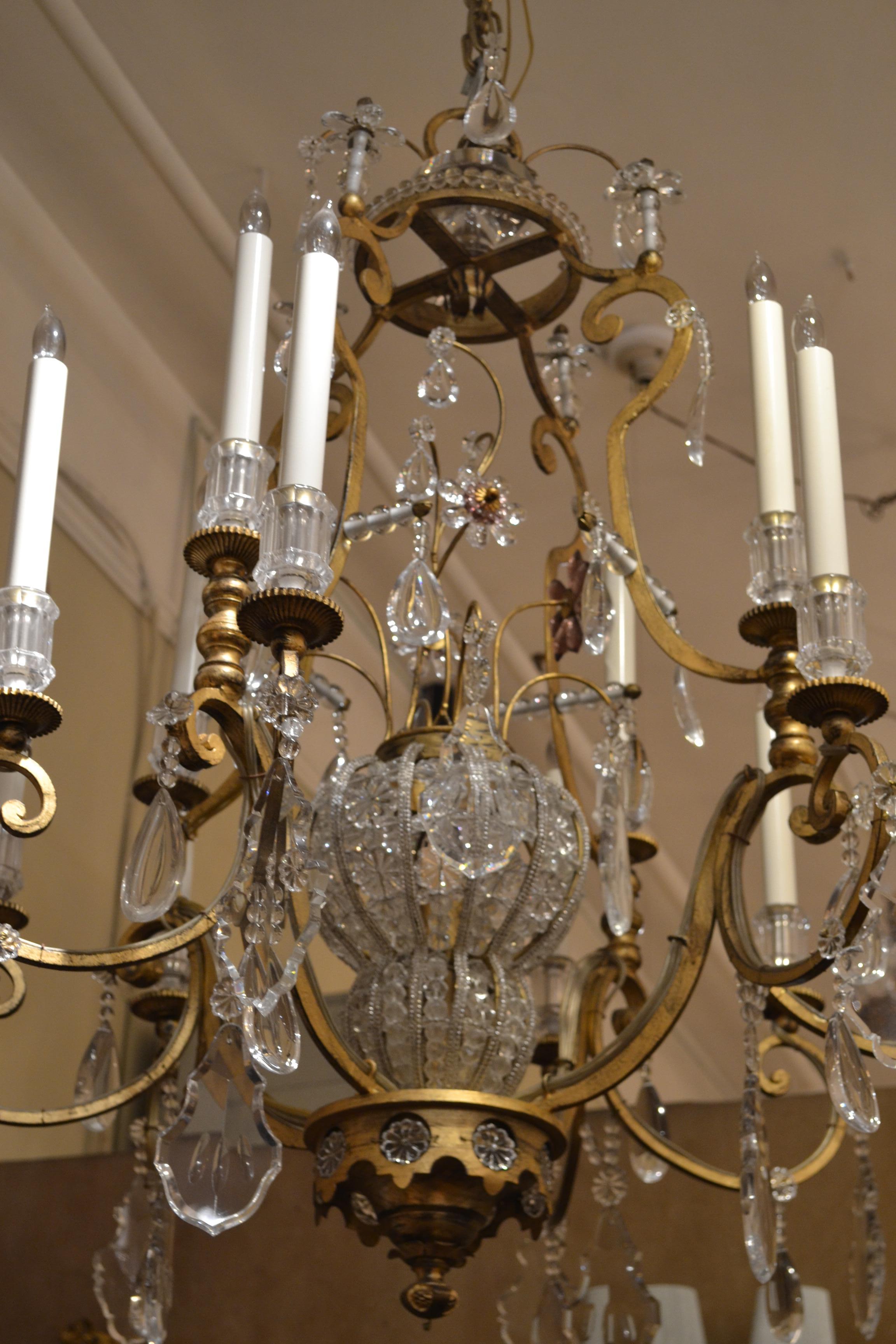 Pair of antique French iron and crystal chandeliers.
