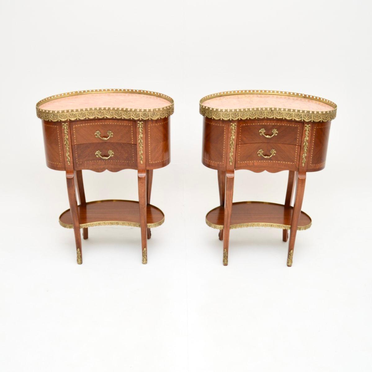 A stunning pair of antique French kidney shaped marble top side tables. These were made in France, they date from around the 1930’s.

They are of fabulous quality and are a very useful size. They would be perfect for use as bedside cabinets or end