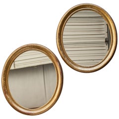 Pair of Antique French Louis Philippe Oval Gold Framed Mirrors, circa 1890