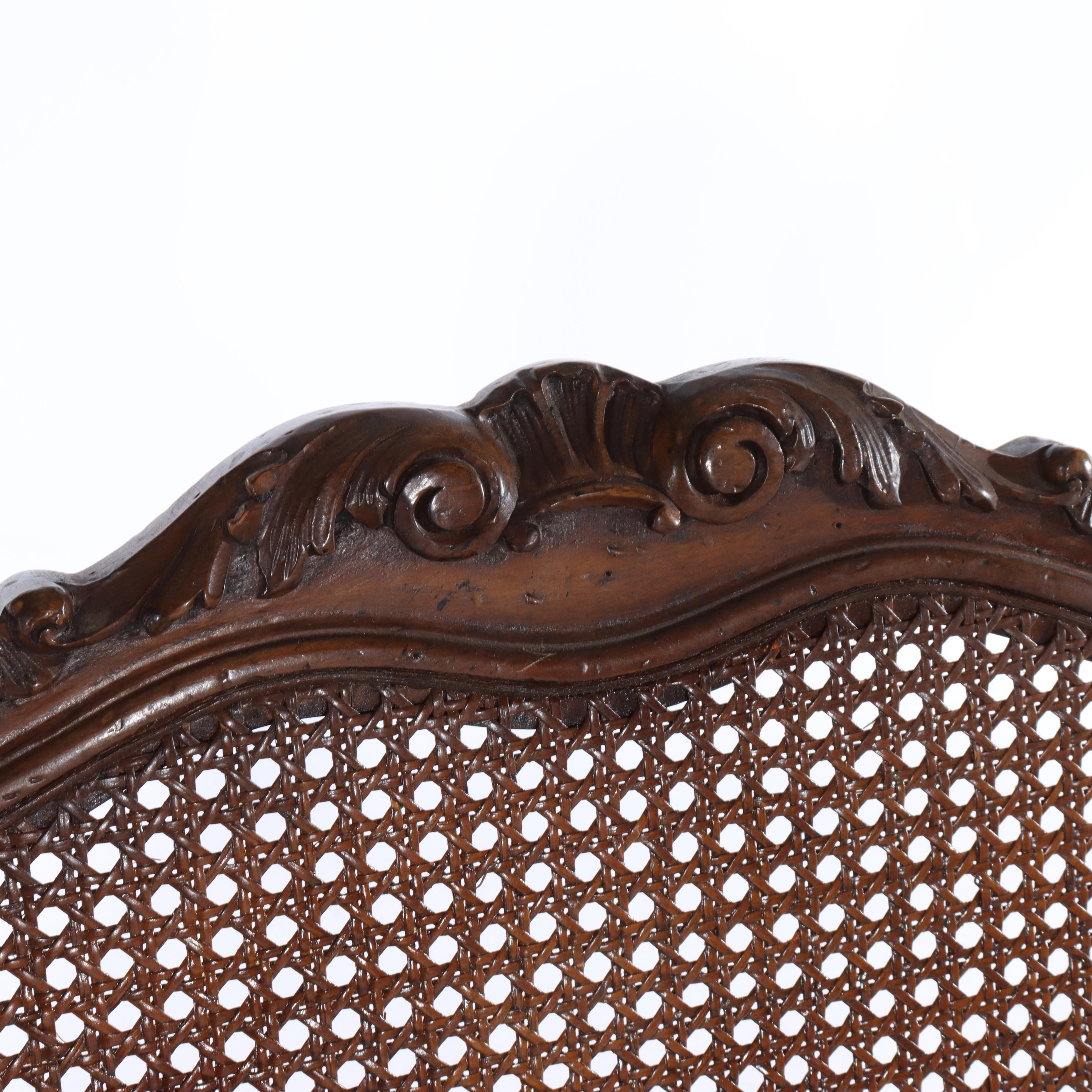 ***Reduced In-House Delivery Rates - Click on “Ask Seller” to Request a Quote***
Pair of Antique French Louis XIV Walnut & Pressed Cane Armchairs 20thC.   
Measures - 35.75