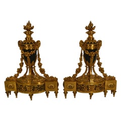 Paire de chenets français anciens de style Louis XV