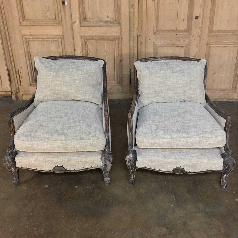 Pair of antique French Louis XV armchairs, bergeres was a design intended for sheer comfort - invented hundreds of years ago! The armrests are obvious, but the upholstered and padded section under the armrest connecting to the seat is not: it was