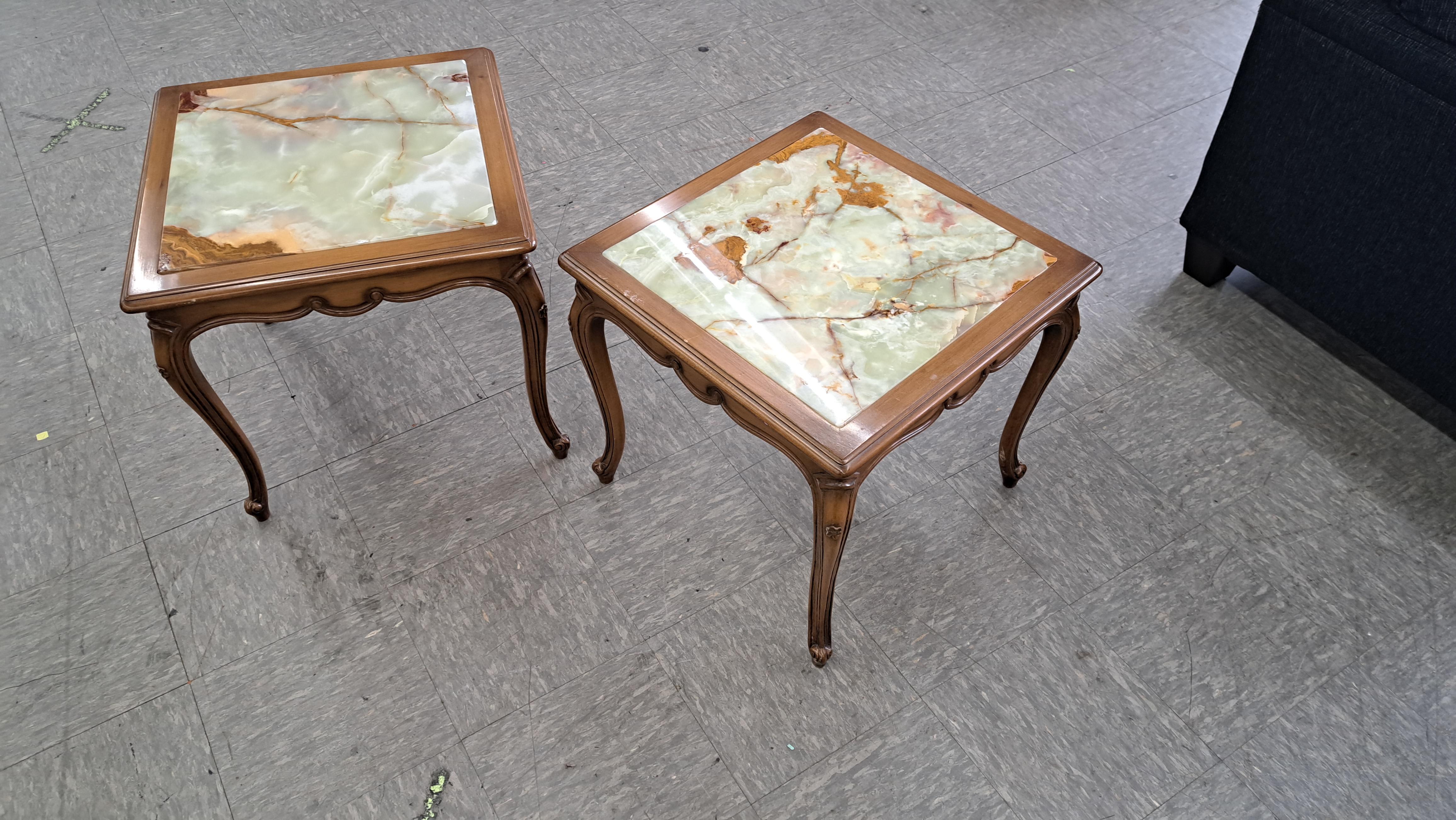 Pair of carved wood side tables with marble inserts. Louis XV style tables with elegantly carved legs and ornate wood framing the tile tops.